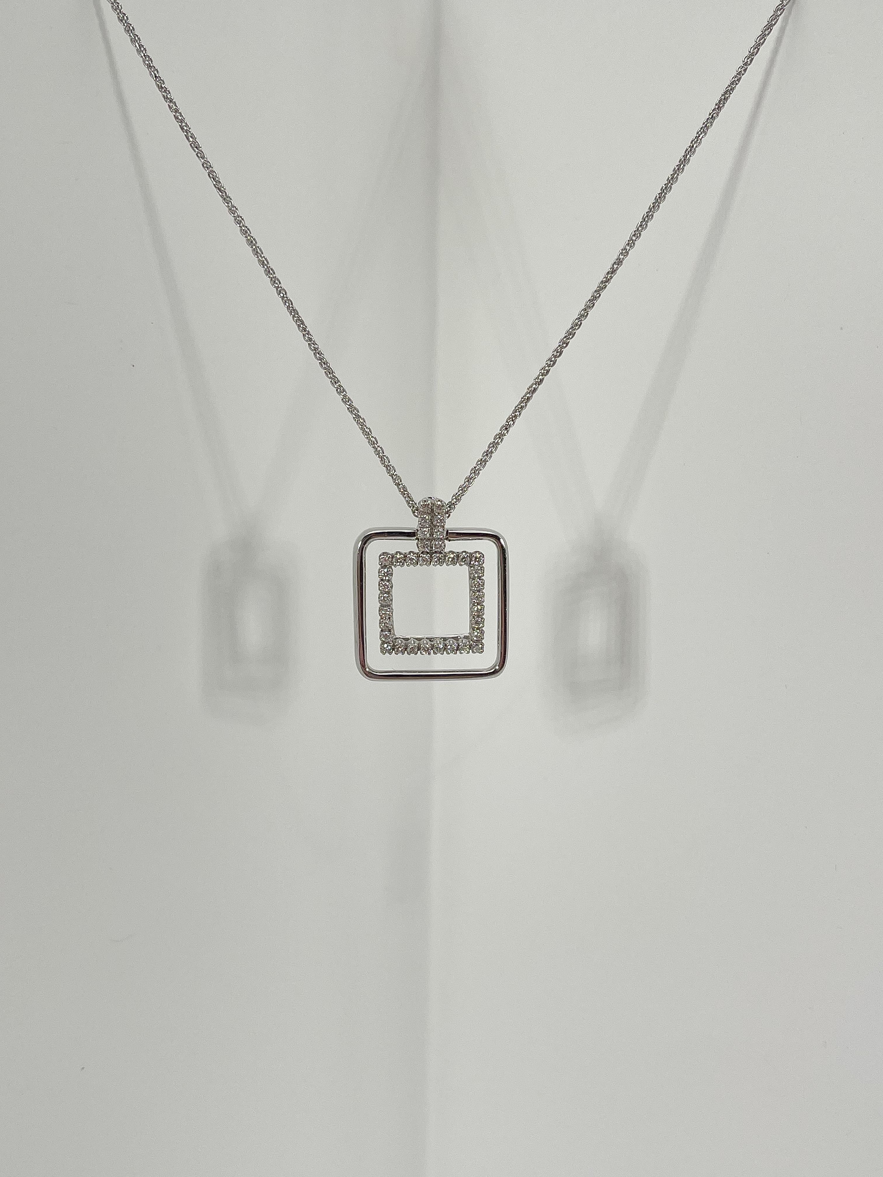 18k white gold square .33 CTW diamond pendant necklace. The diamonds in the pendant are all round, the length of the necklace is 16 inches, the pendant measures to be 17.5mm x 17.5mm for the outside square, 11.5mm x 11.5 mm for the diamond square,
