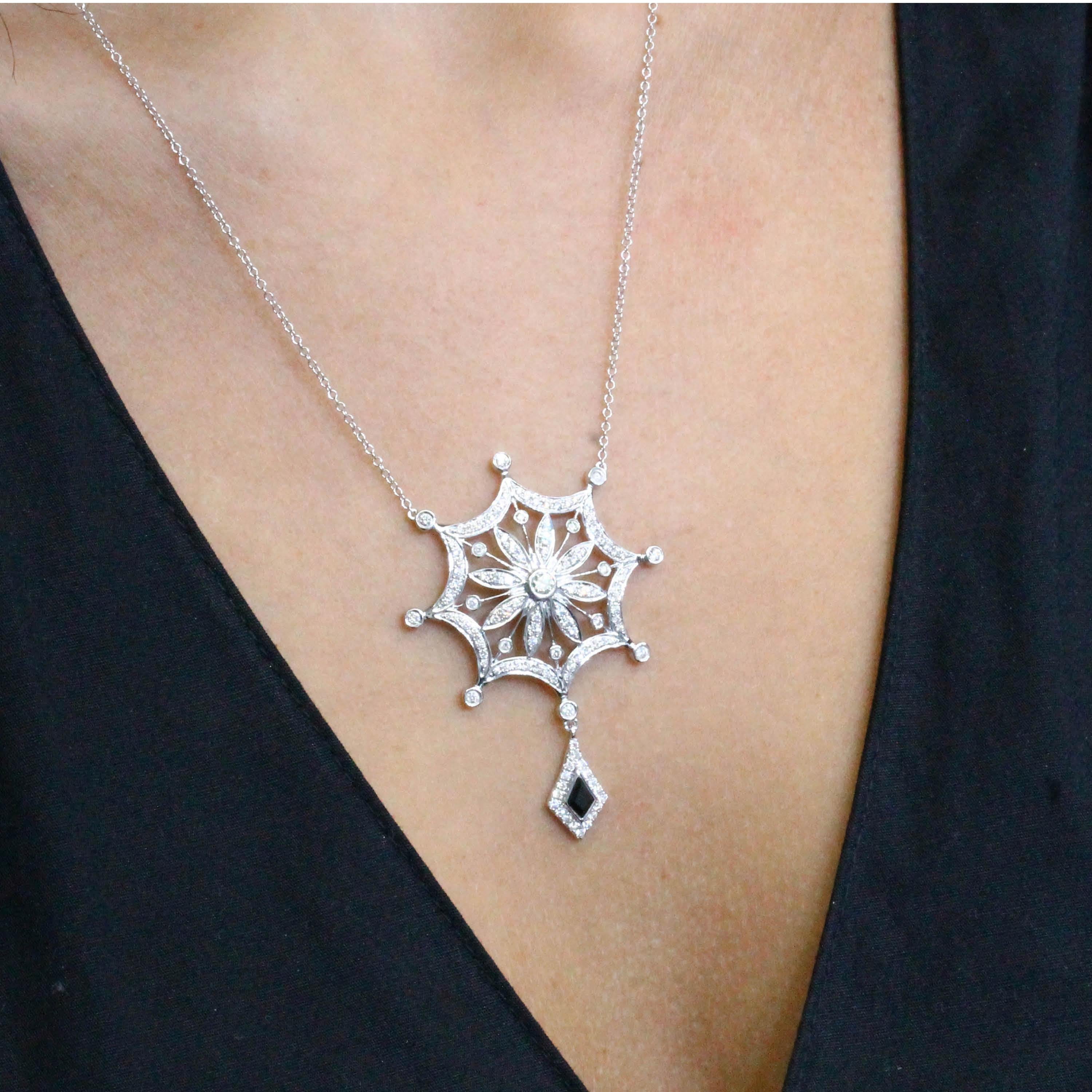 One-of-a-Kind, Statement-making Art-Deco Style Necklace featuring a Snowflake Shaped design with over 1 Carat of Diamonds, and Onyx Accent, hanging on an 18-inch Chain with 16-inch adjuster. Black Onyx is a chalcedony quartz mined in Brazil,