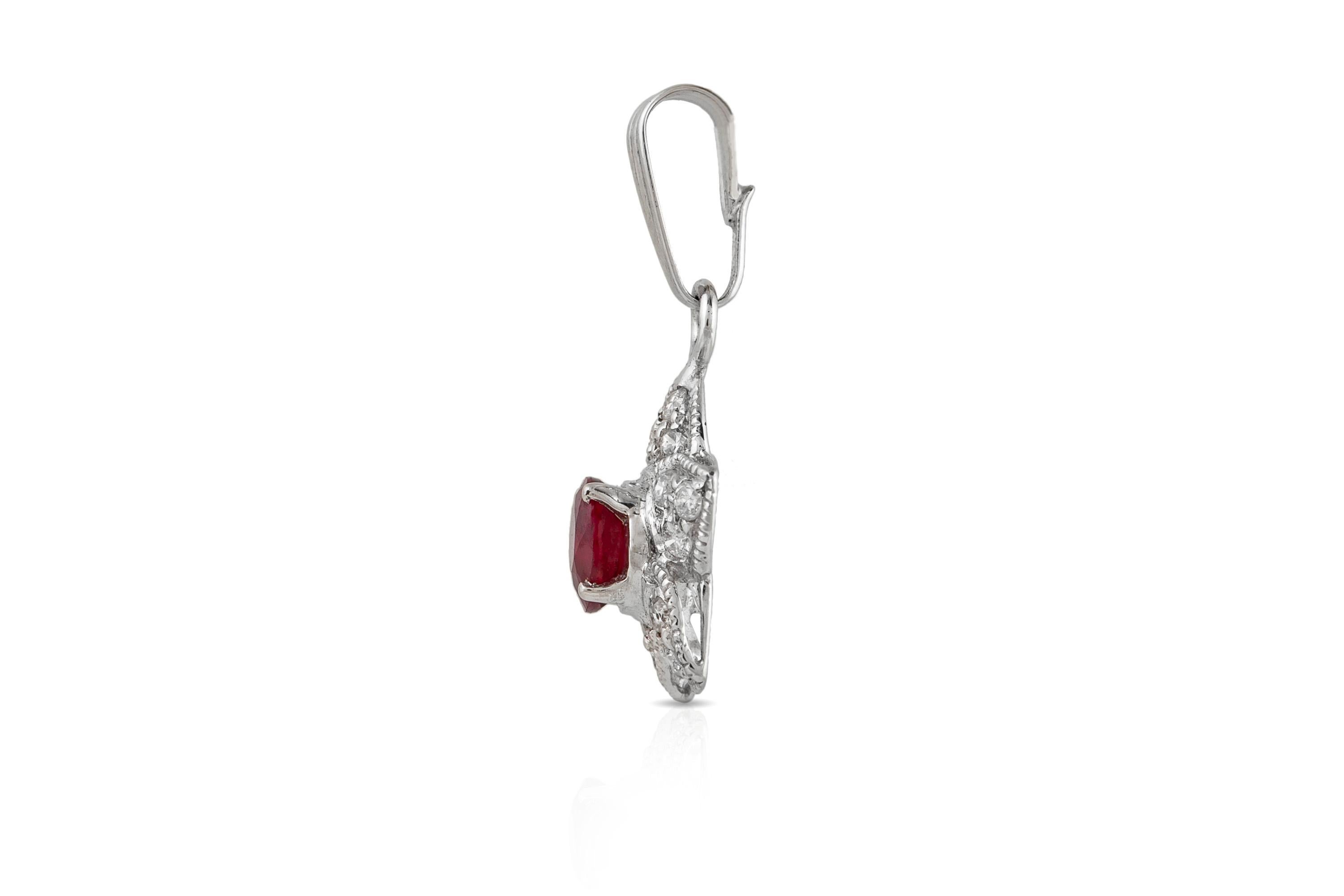 The pendant is finely crafted in 18k white gold with center ruby weighing approximately total of 0.45 carat and diamonds weighing approximately total of 0.14 carat.
Circa 1980.