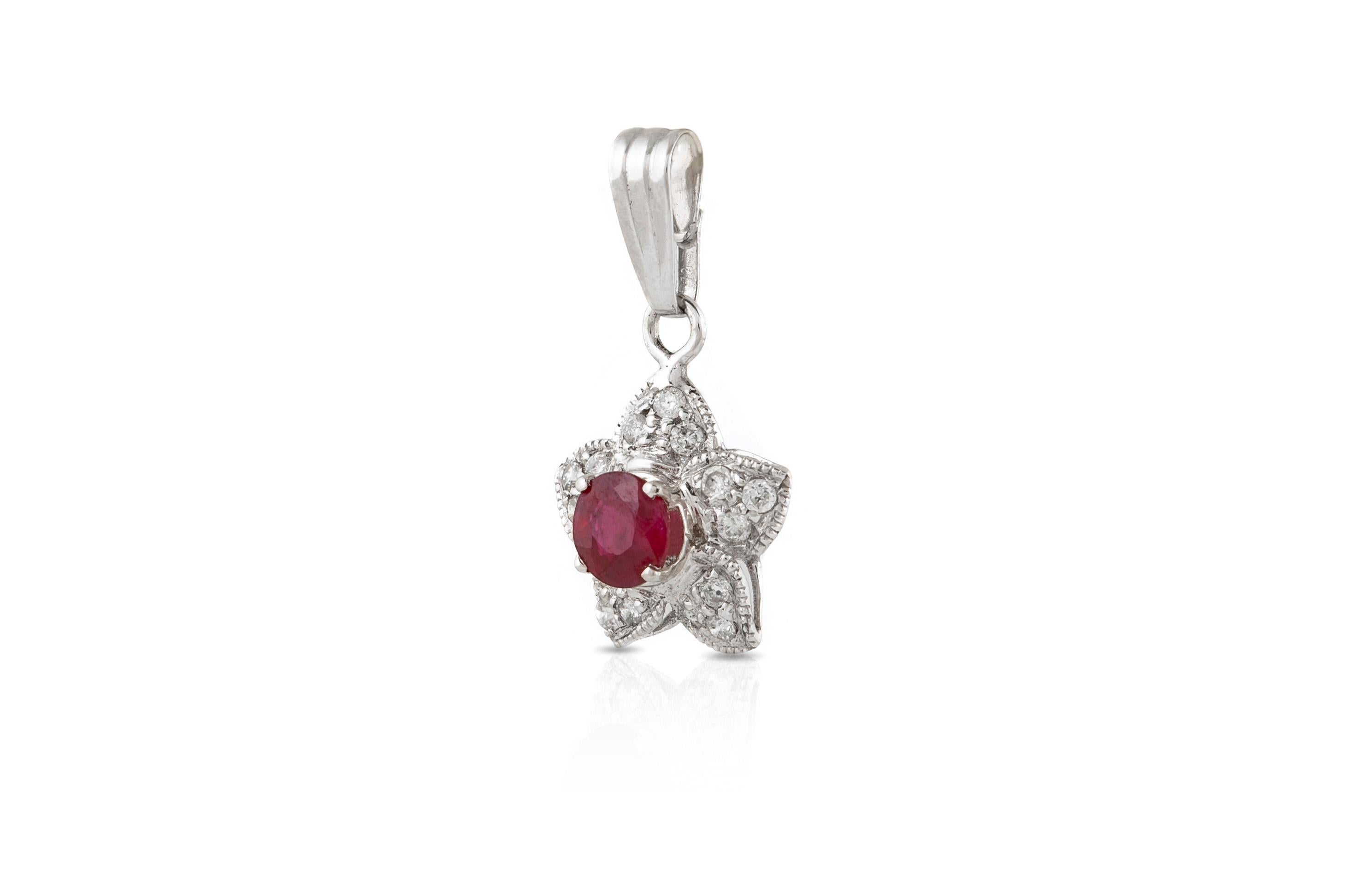 Round Cut 18 Karat White Gold Star with Center Ruby and Diamonds Pendant For Sale
