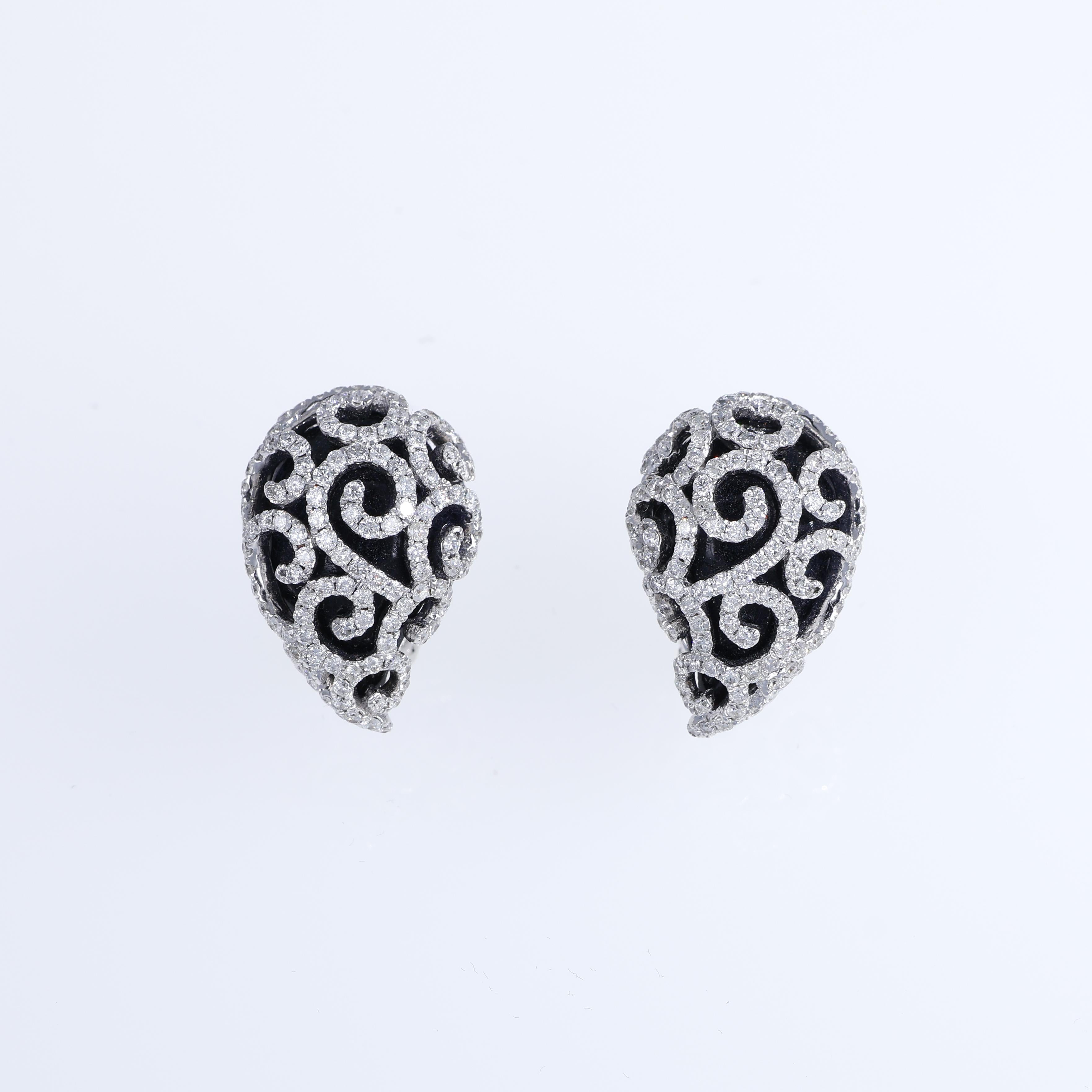 A sophisticated pair of 18K white gold stud earrings featuring an elegant openwork design adorned with brilliant-cut diamonds totaling 1.89 carats. These earrings combine intricate craftsmanship with timeless glamour, offering a versatile accessory