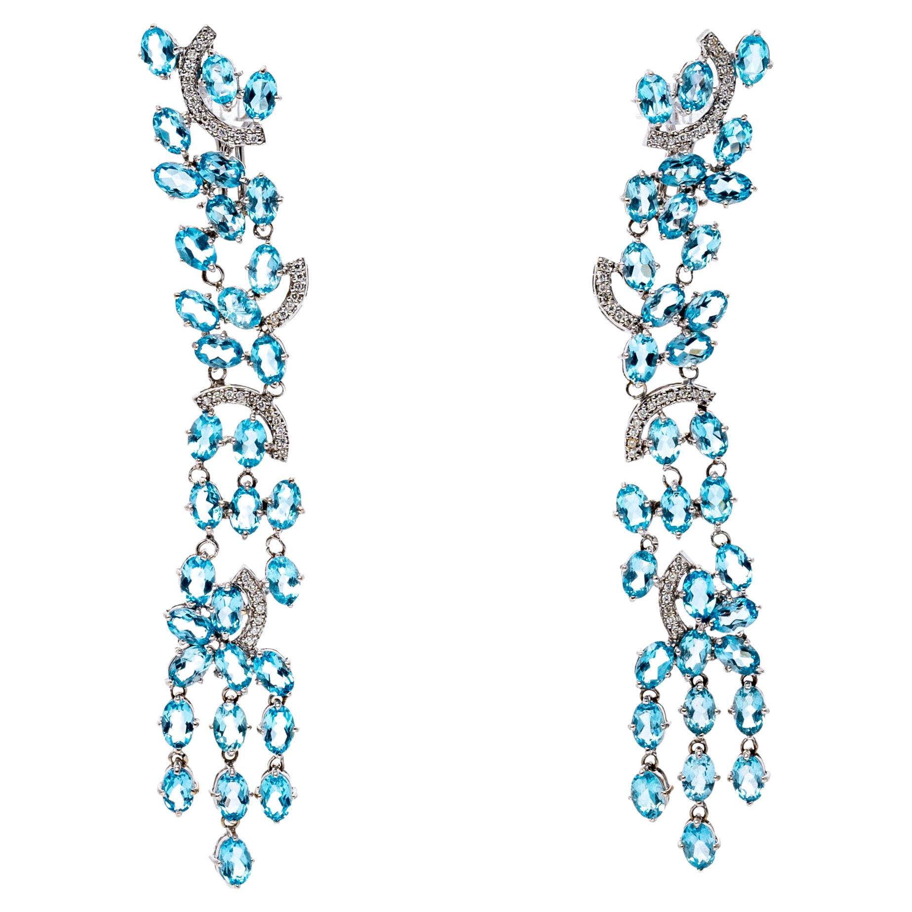 Boucles d'oreilles cascade en or blanc 18 carats, diamant et topaze bleue