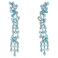 Boucles d'oreilles cascade en or blanc 18 carats, diamant et topaze bleue
