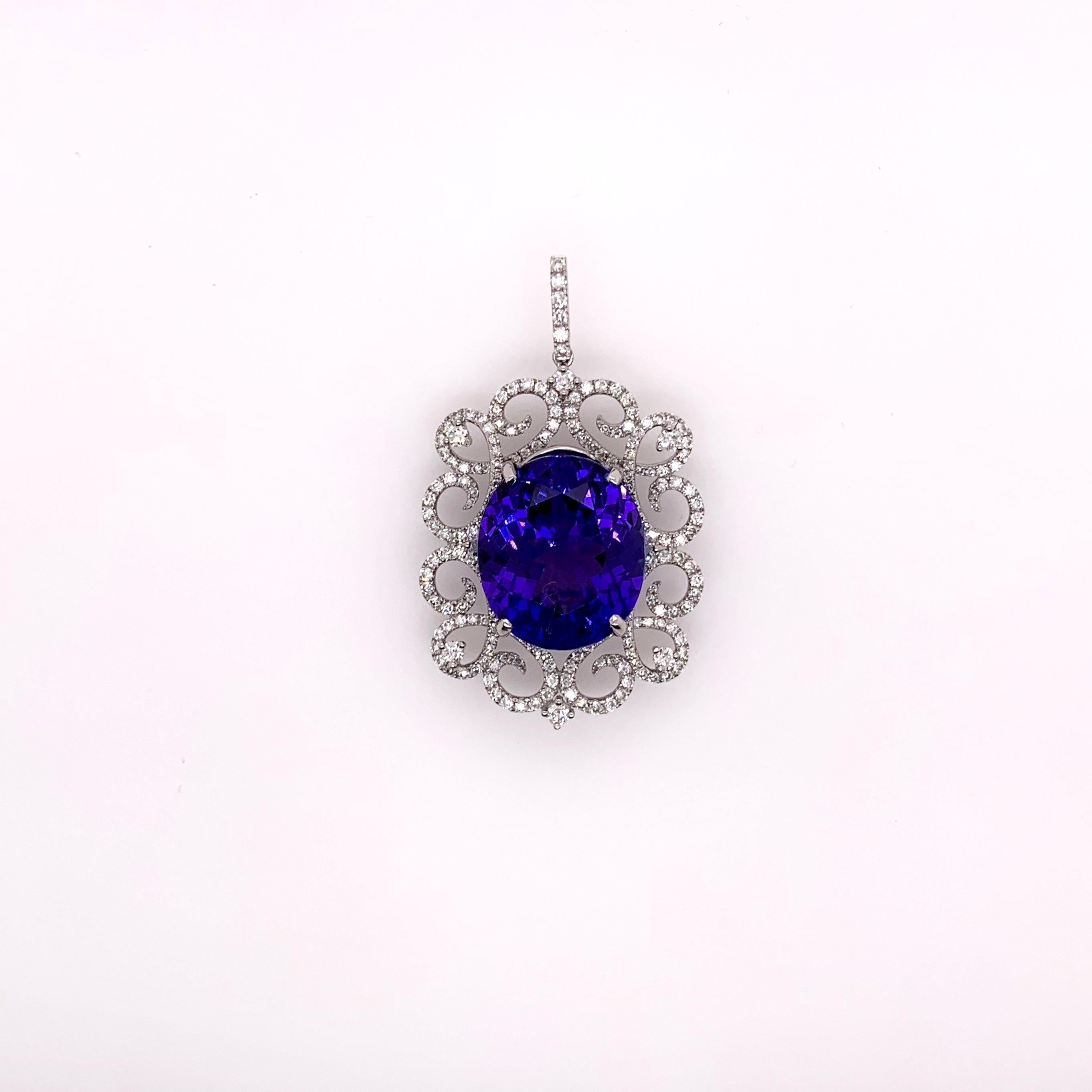 This stunning tanzanite is set in a gorgeous, symmetrical diamond setting that further highlights the top quality tanzanite.  The meticulous details involved in this setting truly catches everyone's attention.

Tanzanite: 18.80 cts, Oval