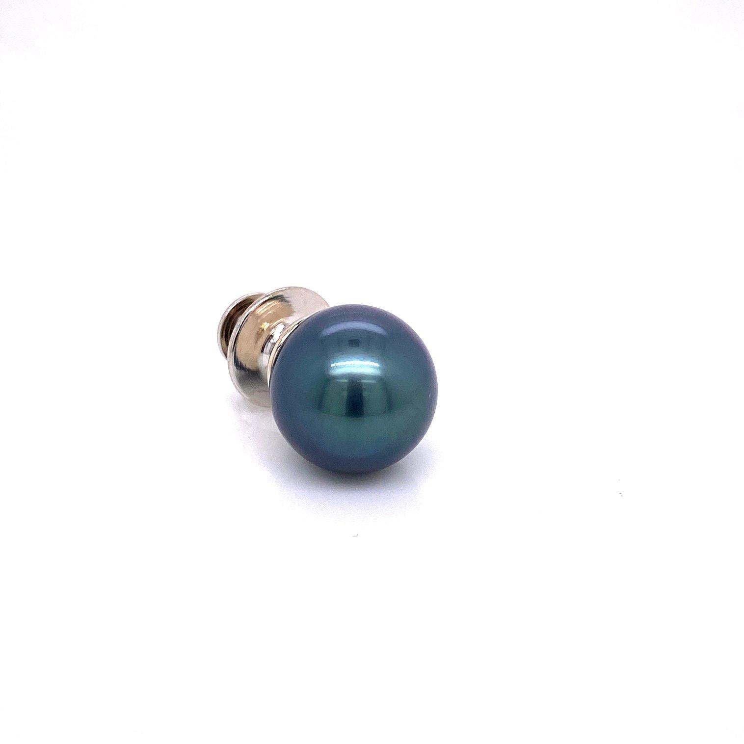A Tahitian pearl lapel pin/tie tack in 18k white gold with plated clutch. Designed and made by llyn strong.