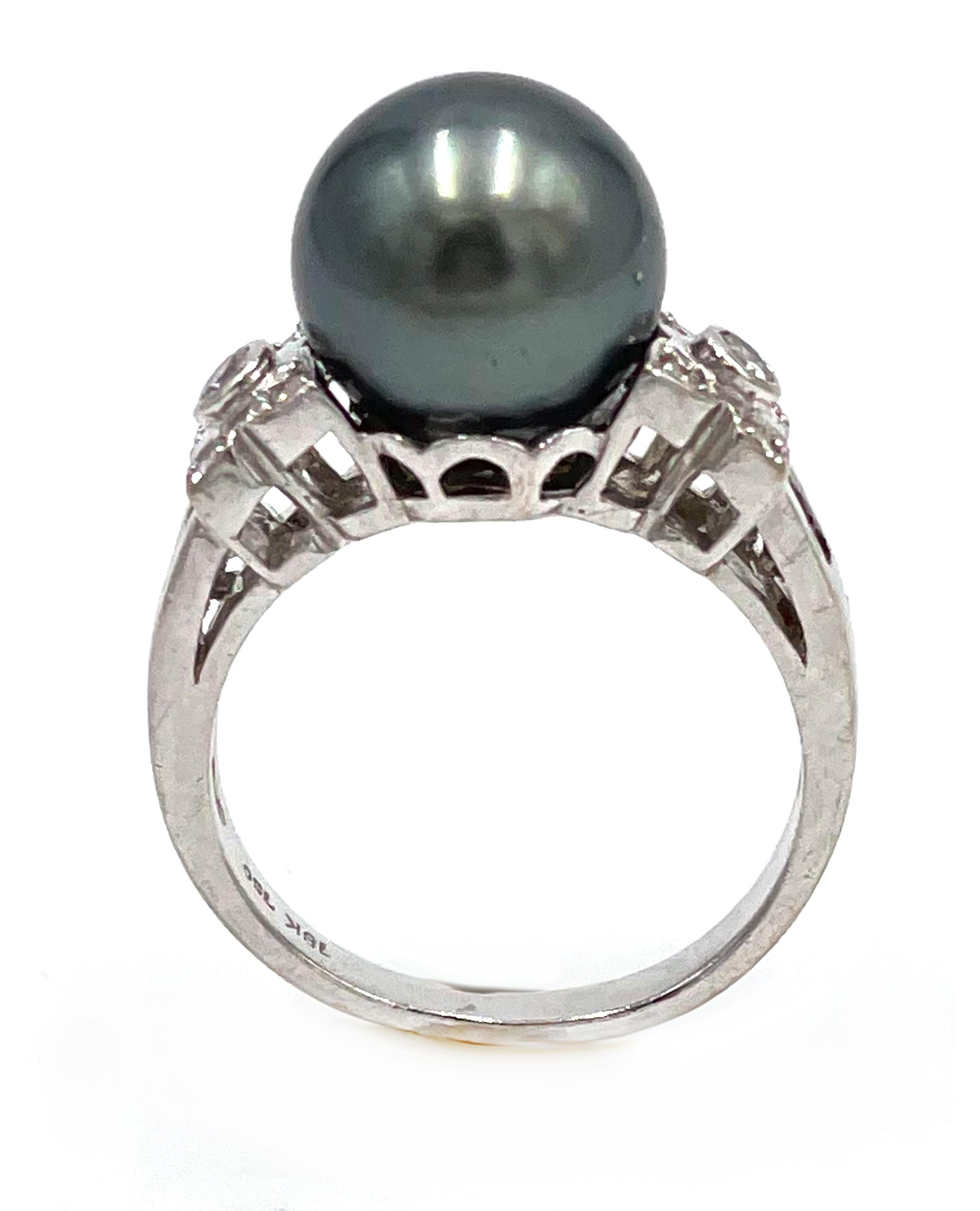 Pre owned 18K white gold Tahitian South Sea pearl ring with 10 round faceted diamonds and 6 baguette diamonds weighing approximately 0.25 carats total.


* Finger size 6
* Diamonds are on average H/I/ color, SI clarity.

