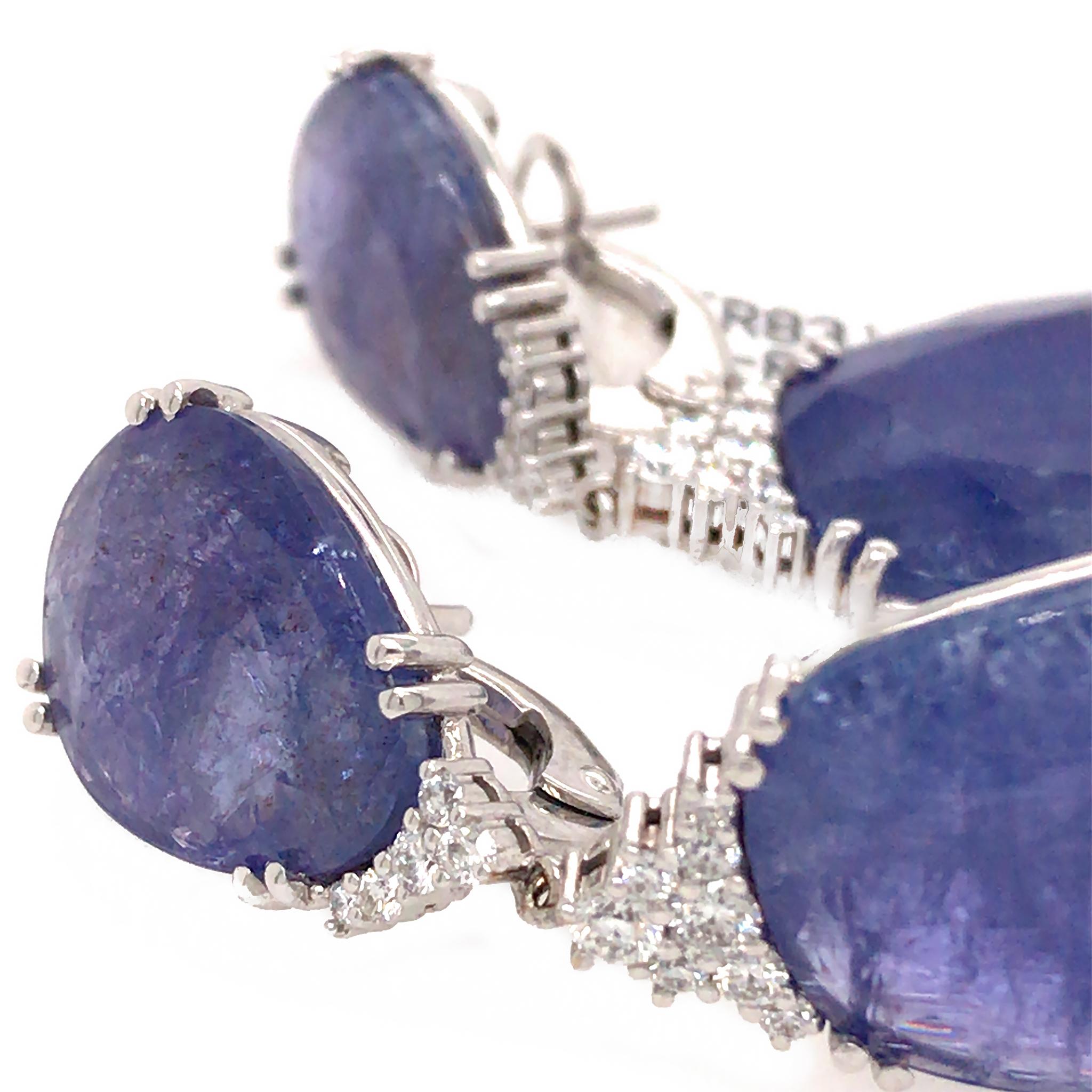 18k White Gold
Diamond: 0.55 ct twd (estimated)
Tanzanite: 52.99 tcw
Length: 2 inches
Total Weight: 19 grams