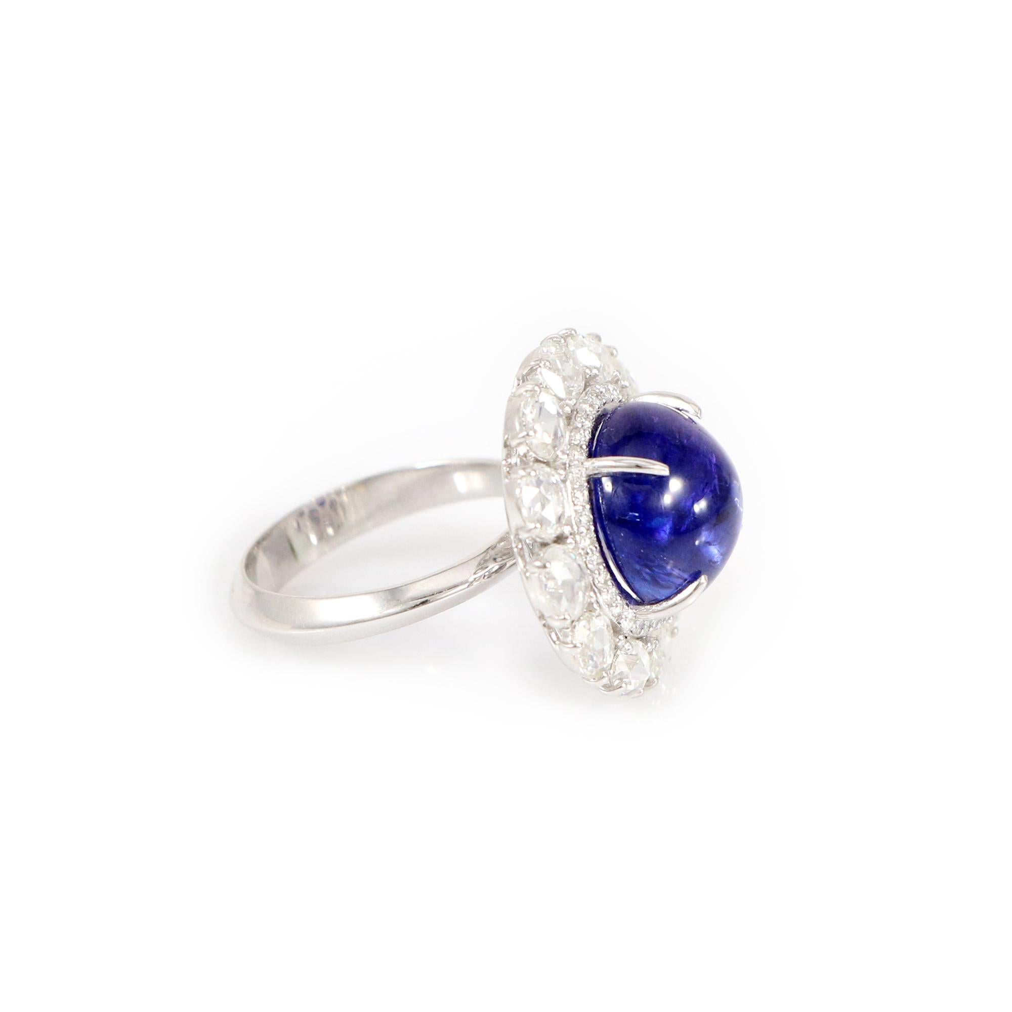 Introducing our exquisite white gold ring adorned with the rare and captivating Tanzanite, framed by shimmering oval-shaped rose-cut diamonds. These distinctive oval diamonds accentuate the Tanzanite's exceptional beauty, creating a mesmerizing