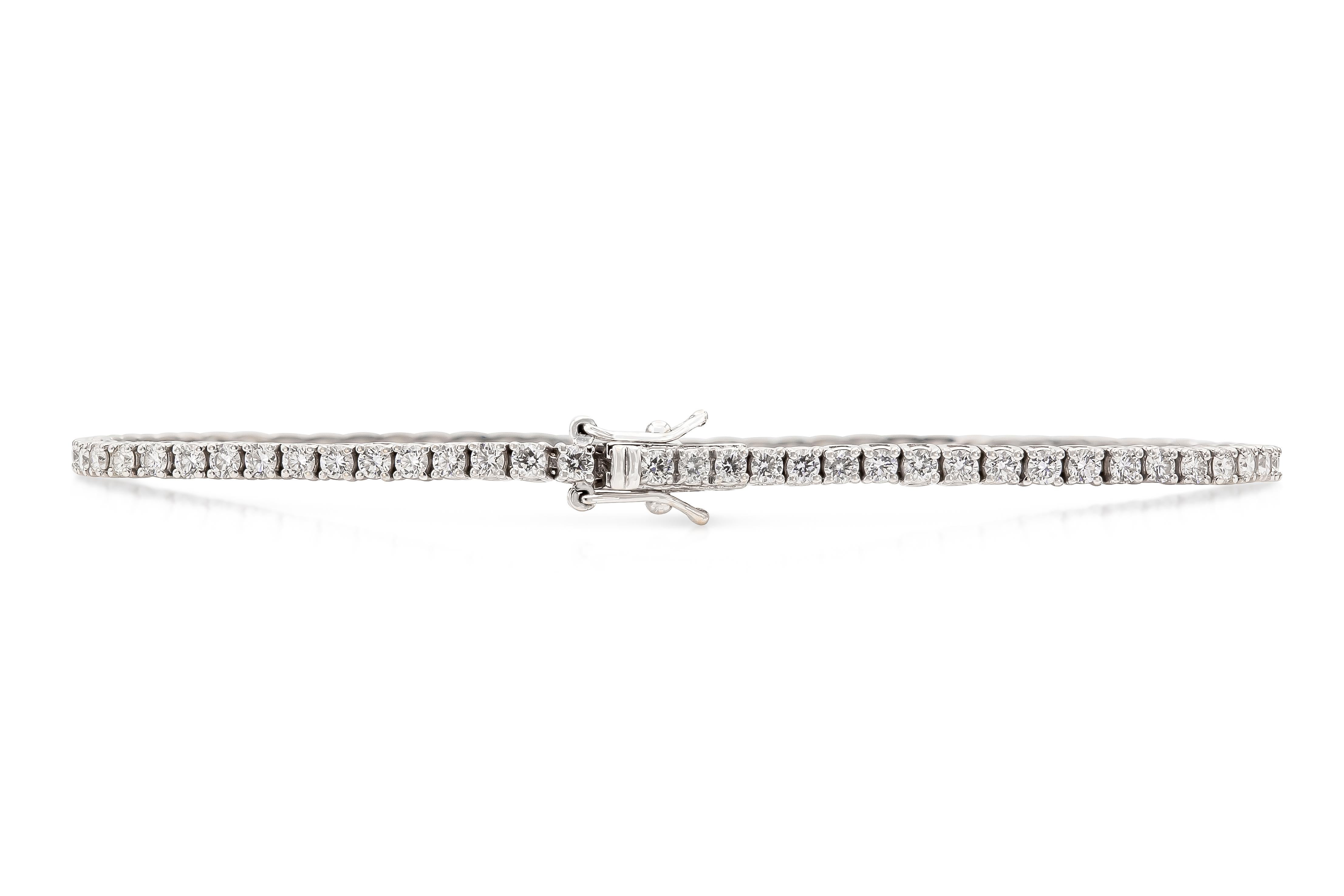 Handmade 18K White Gold Tennis Bracelet with 75 Round Brilliant Cut Diamonds D color VVS clarity DTW. 2.38 carat
Length 7 inch 

Viewing available in our NYC office. 