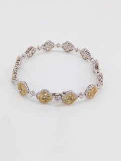 18K White Gold Tennis Bracelet Featuring  Round Fancy Yellow and White Diamonds