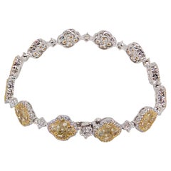 18K White Gold Tennis Bracelet Featuring  Round Fancy Yellow and White Diamonds