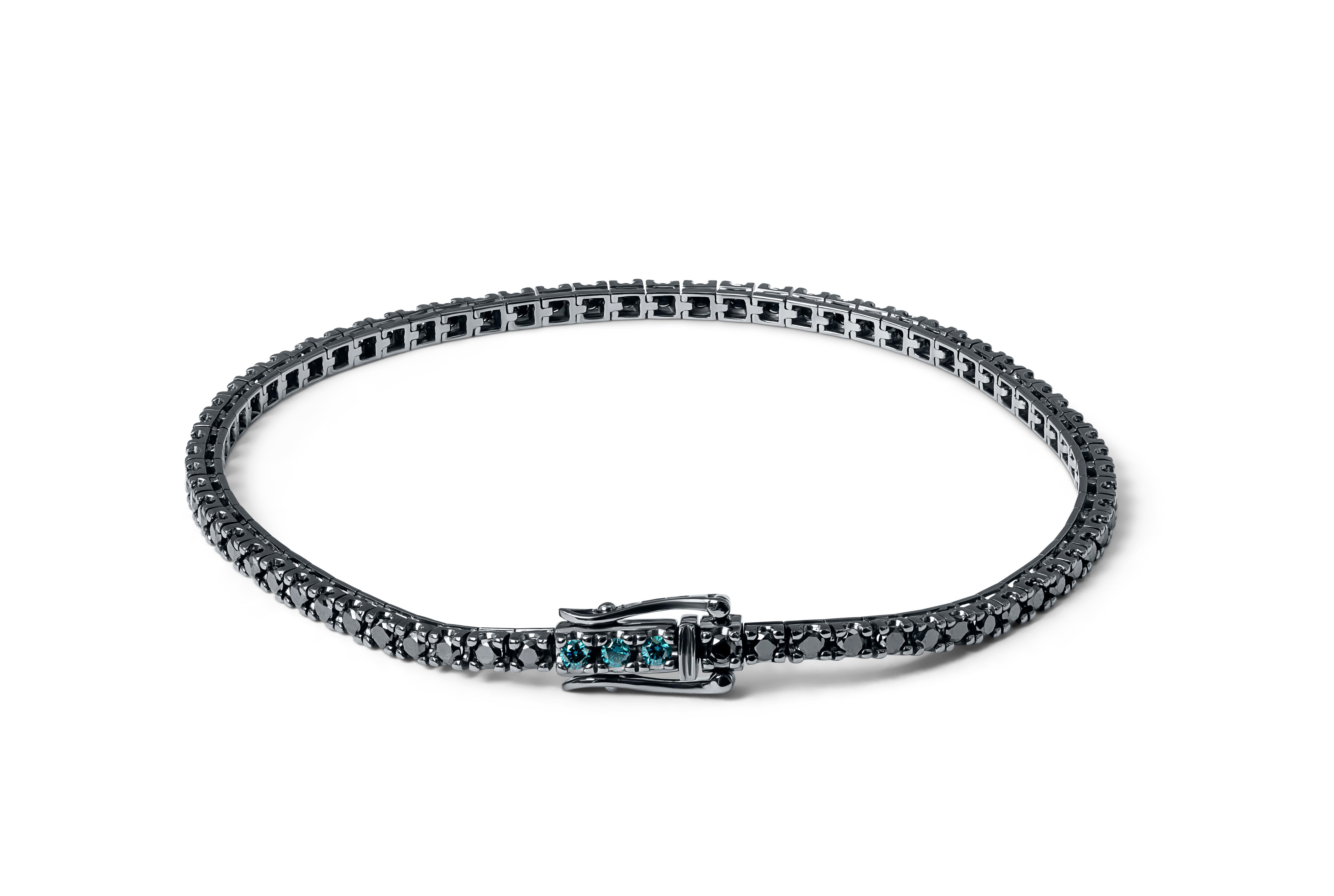 Tennis Bracelet in Black, Blue Diamonds with Black Rhodium Plated 18K White Gold

Tateossian continues to explore and find beauty in traditional diamonds which for years have lent themselves to original and pioneering designs. This tennis bracelets
