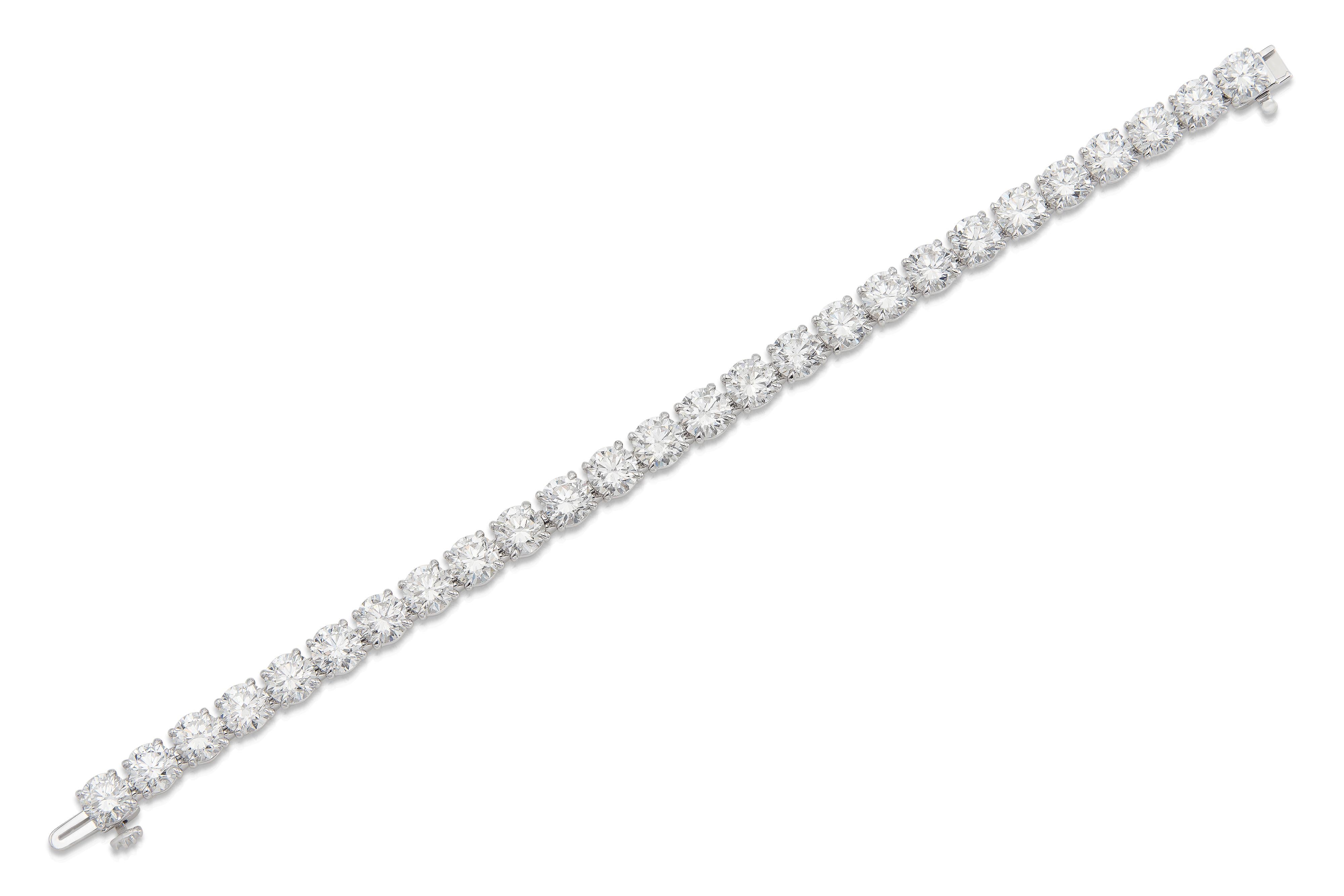 Handmade 18K White Gold Tennis Bracelet with 26 Round Brilliant Cut Natural Diamonds D-E-F color SI1-SI2 clarity weighting 26.17 carat, 7 inch. All Diamonds are GIA certified.  