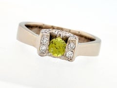 18 Karat White Gold Tension Set Peridot and Diamond Horseshoe Ring