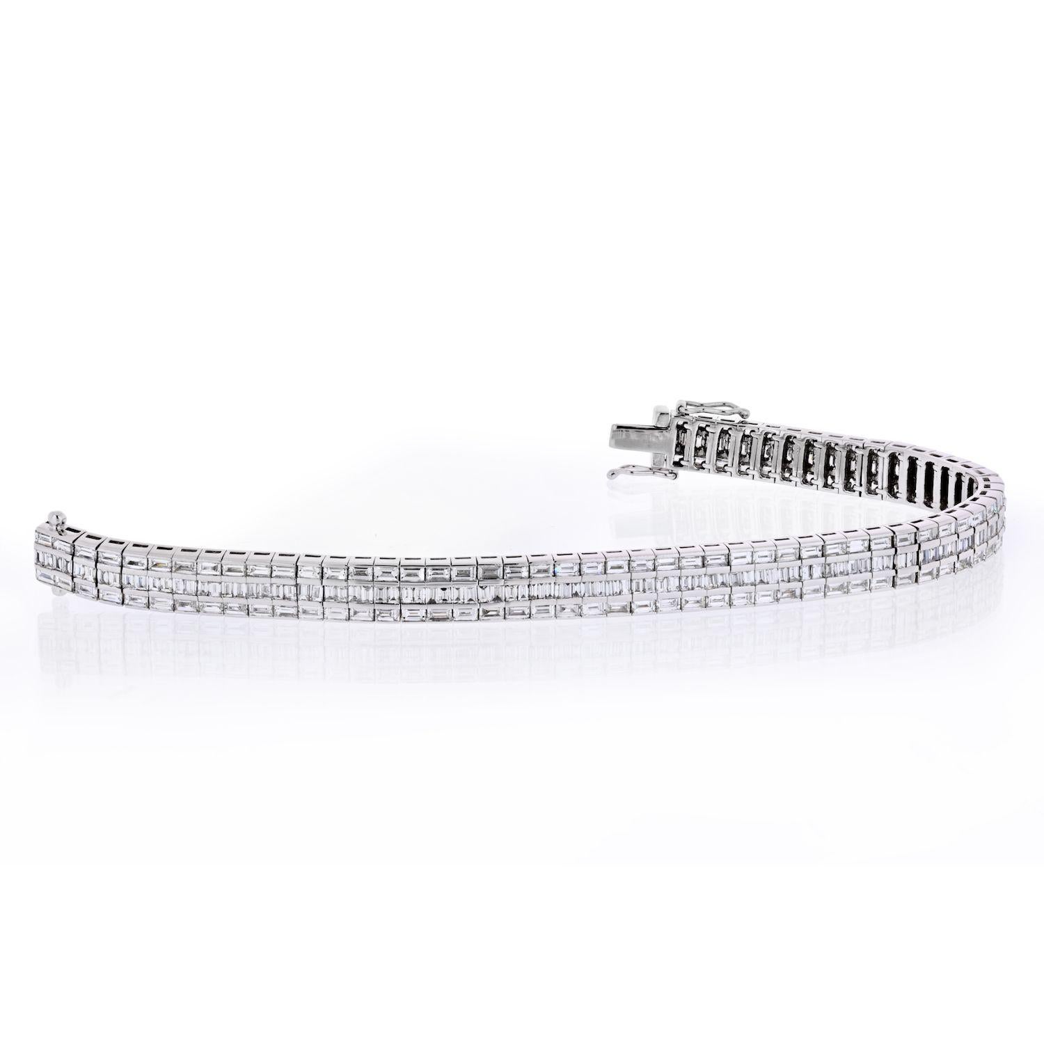 This glistening 3 Row Diamond Tennis Bracelet is made in 18K white gold weighs approximately 15 carats in diamond weight and showcases three rows of baguette cut diamonds. 

Featuring a luxurious design and a rhodium plating for extra shine, this