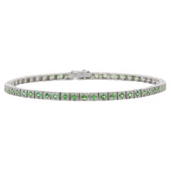 Bracelet tennis en tsavorite naturelle clouté en or blanc massif 18 carats 