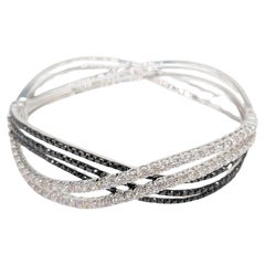 18k White Gold Wave Bangle with Brilliant Cut Round Black and White Diamonds
