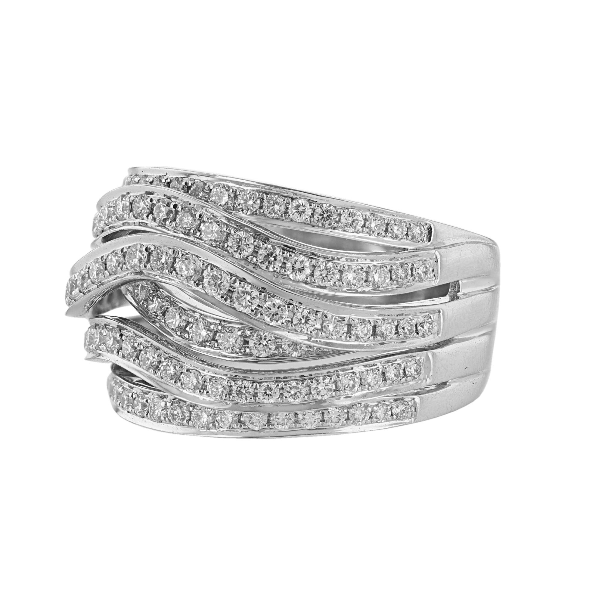 This ring is made in 18K white gold and features 6 rows of 124 round cut diamonds weighing 1.12 carats. With a color grade (H) and clarity grade (SI2). All stones are prong set.

