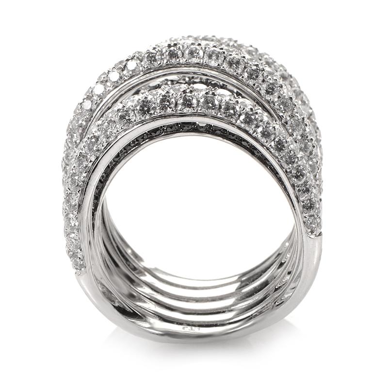 This ring is opulent and shines with diamonds. The setting is made of 18K white gold and boasts a design that features ~4.15ct of black and white diamonds.
Ring Size: 6.75