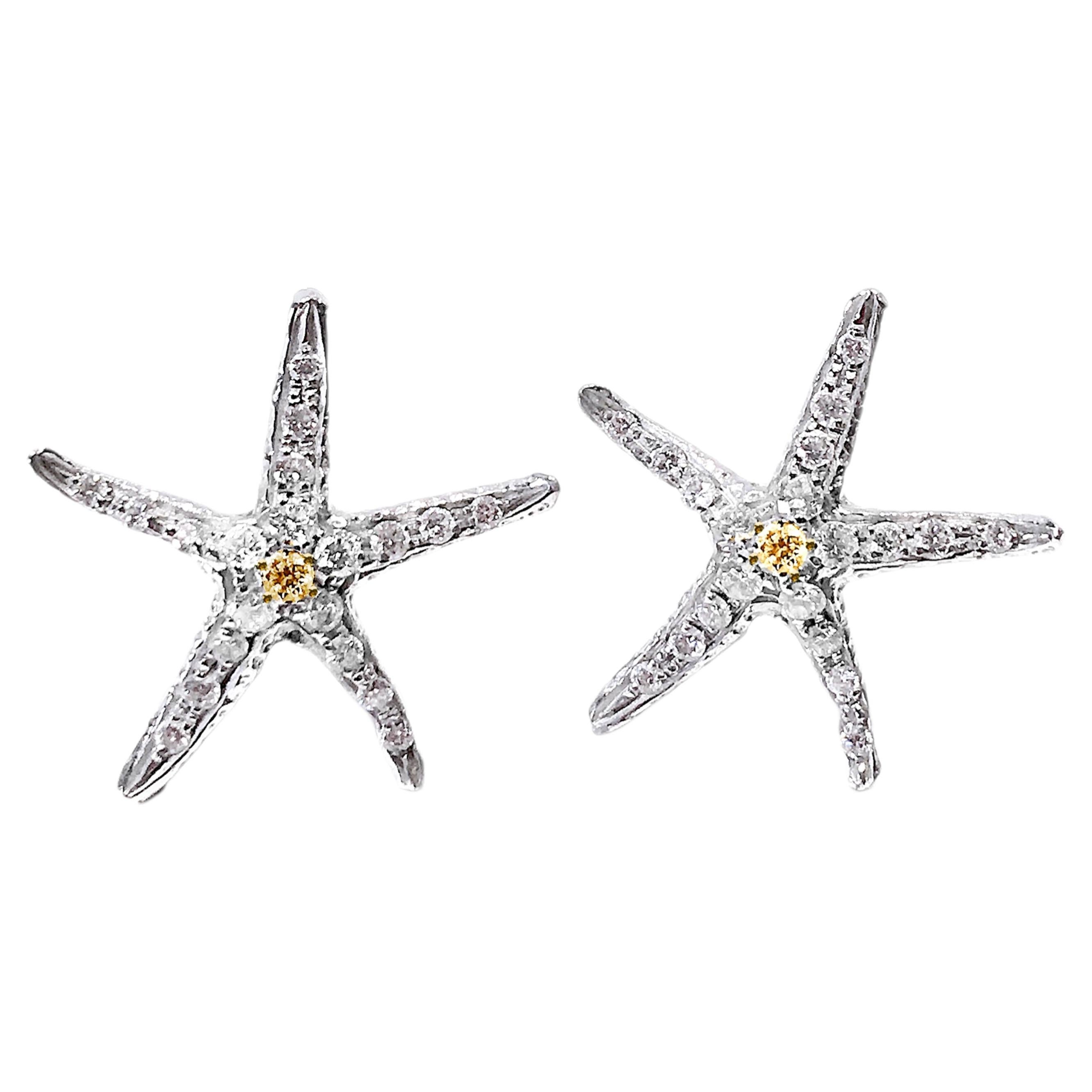 Orecchini con stella marina in oro bianco e giallo 18 carati Made in Italy
