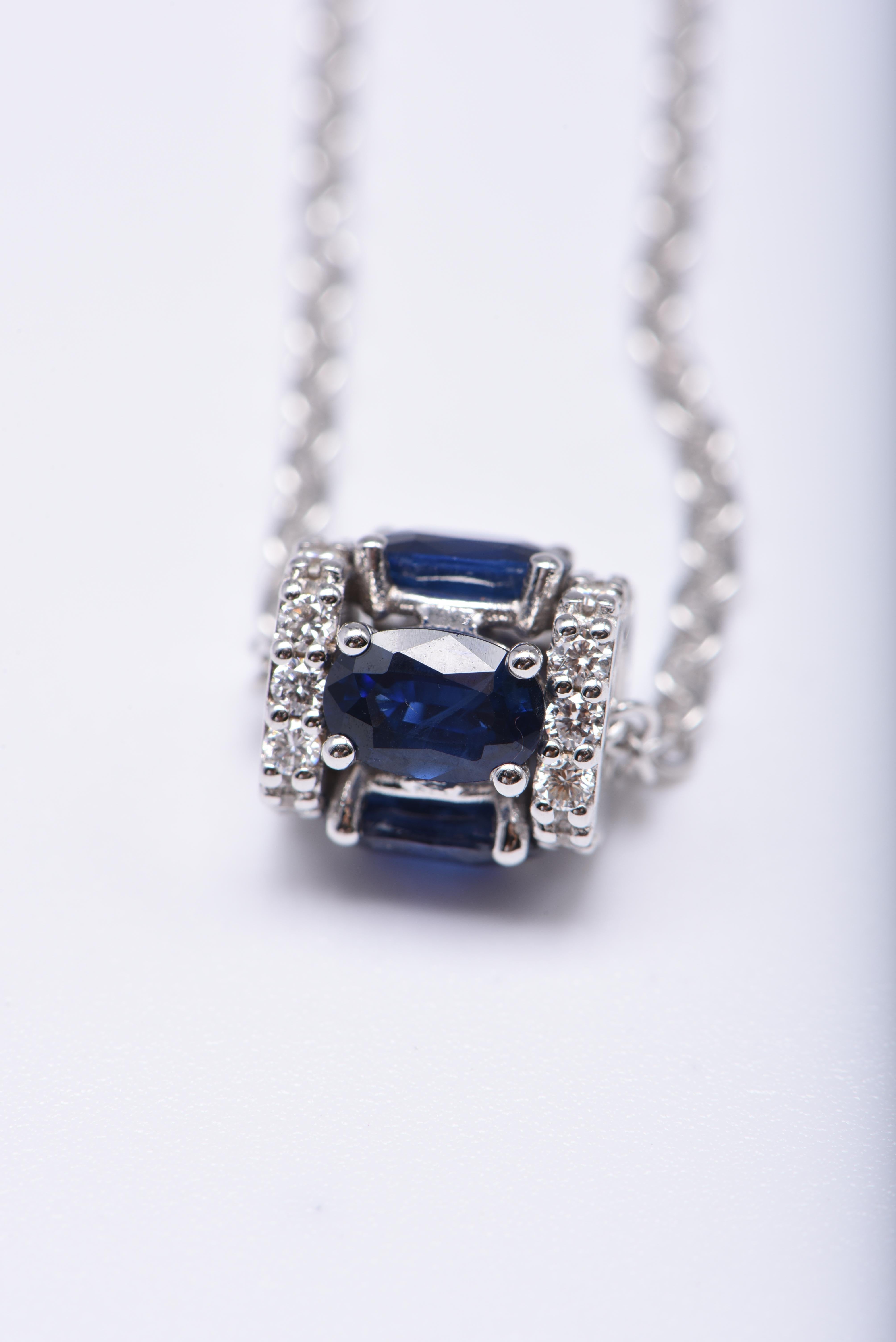 Oval Cut 18K White Gold, White Diamond, and Blue Sapphire Pendant Necklace For Sale
