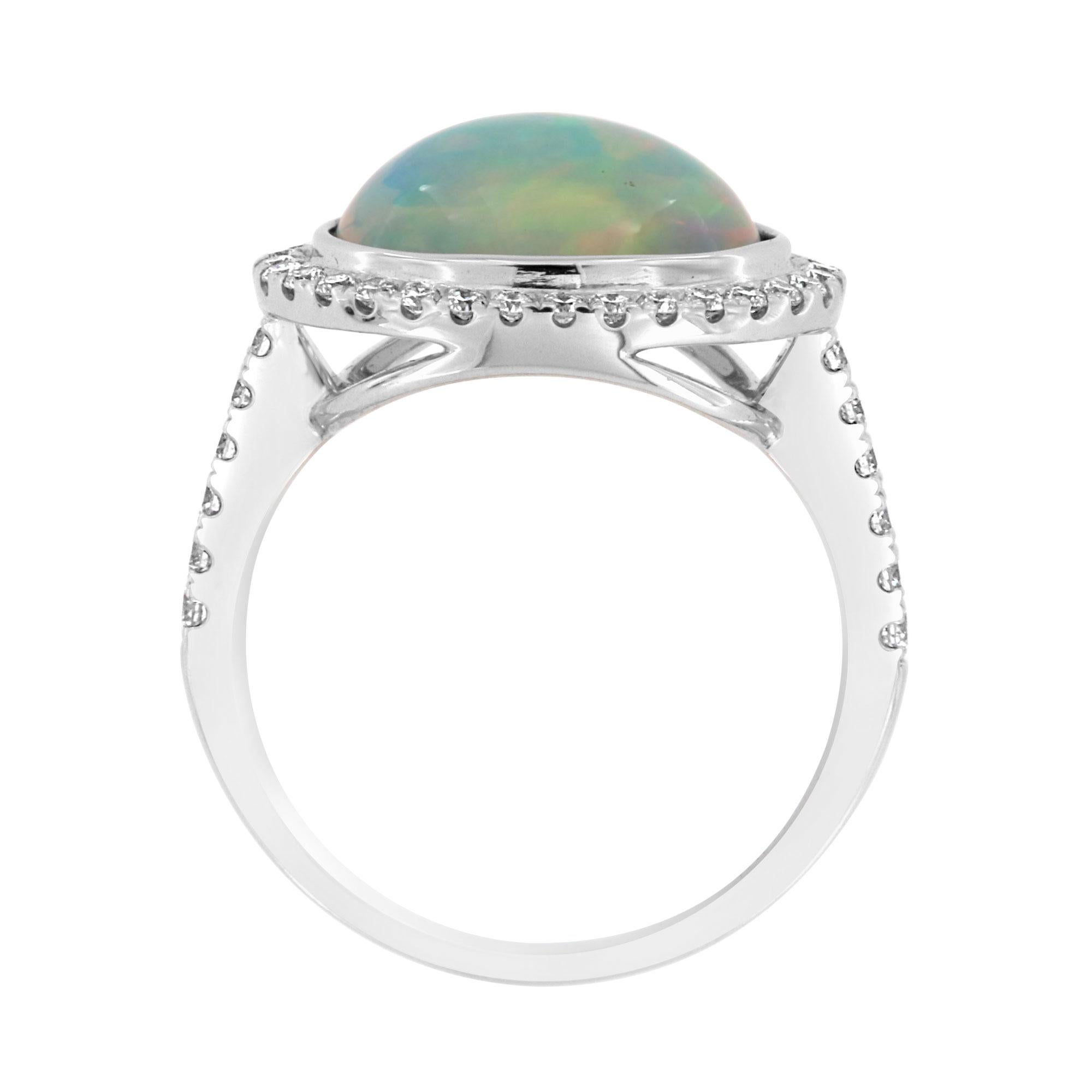 This colorful opal and diamond ring features an oval opal framed by Micro prong round brilliant diamonds in 18k white gold. Experience the Difference!

Product details: 

Center Gemstone Type: Opal
Center Gemstone Carat Weight: 2.79
Center Gemstone
