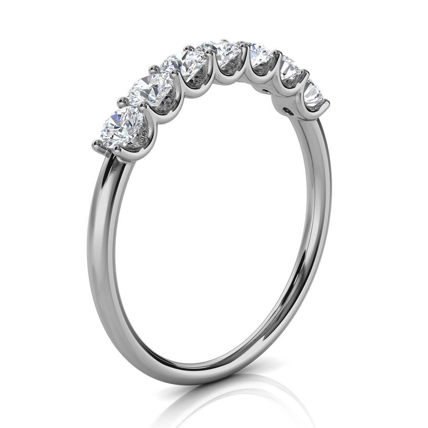 This Delicate ring features Seven (7) floating Brilliante round diamonds set in 