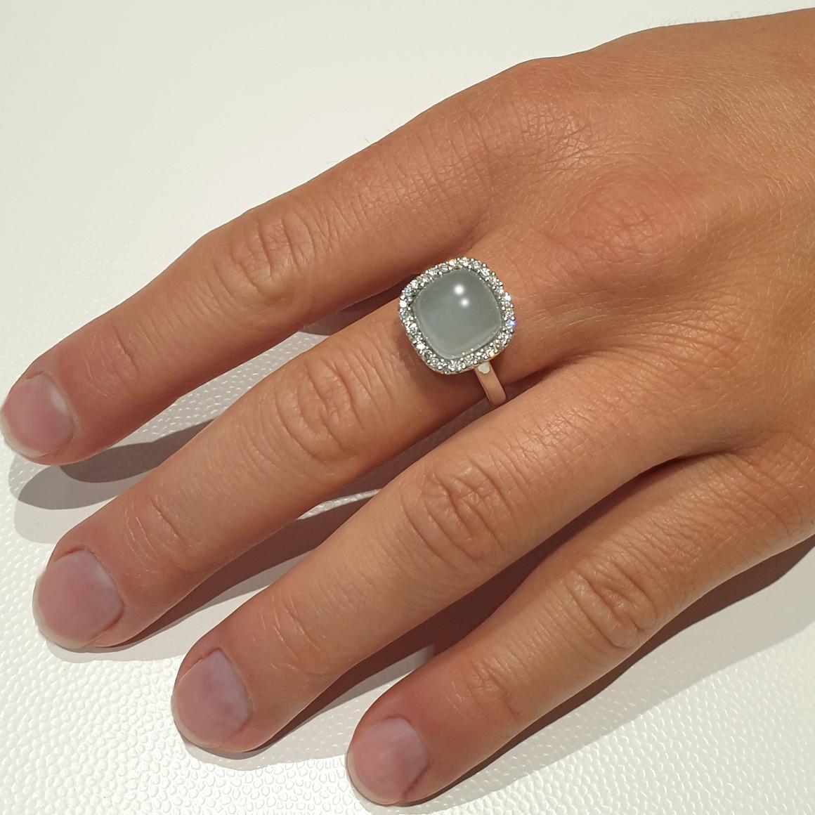  Elegant design ring that lend a class to just any outfit , made in Italy by Stanoppi Jewellery.
Ring in 18k white gold with Aquamarine Milk (square cabochon cut, size: 10x10 mm) and white Diamonds cts 0,35 VS colour G/H. 

Size of ring: EU 13 - USA