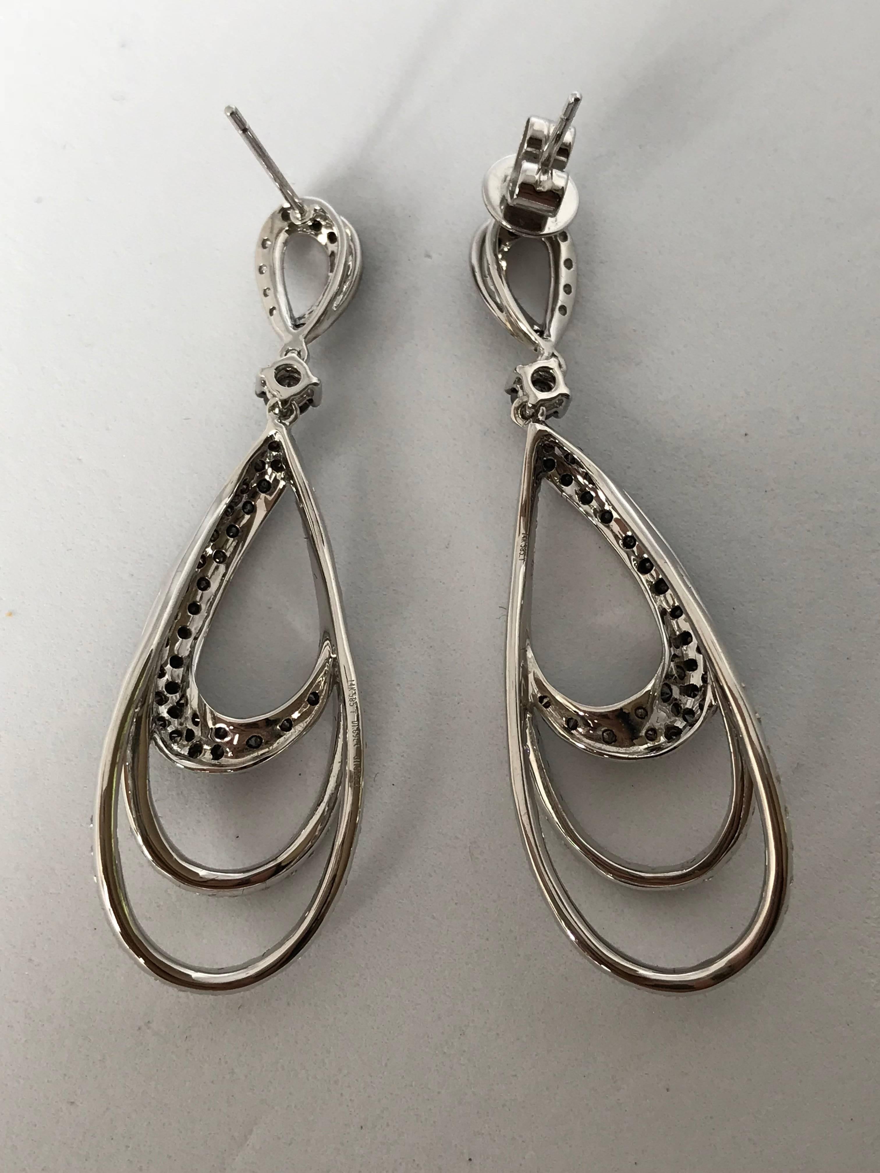 Modern 18k White Gold with black and white Diamond Twisted Earring For Sale