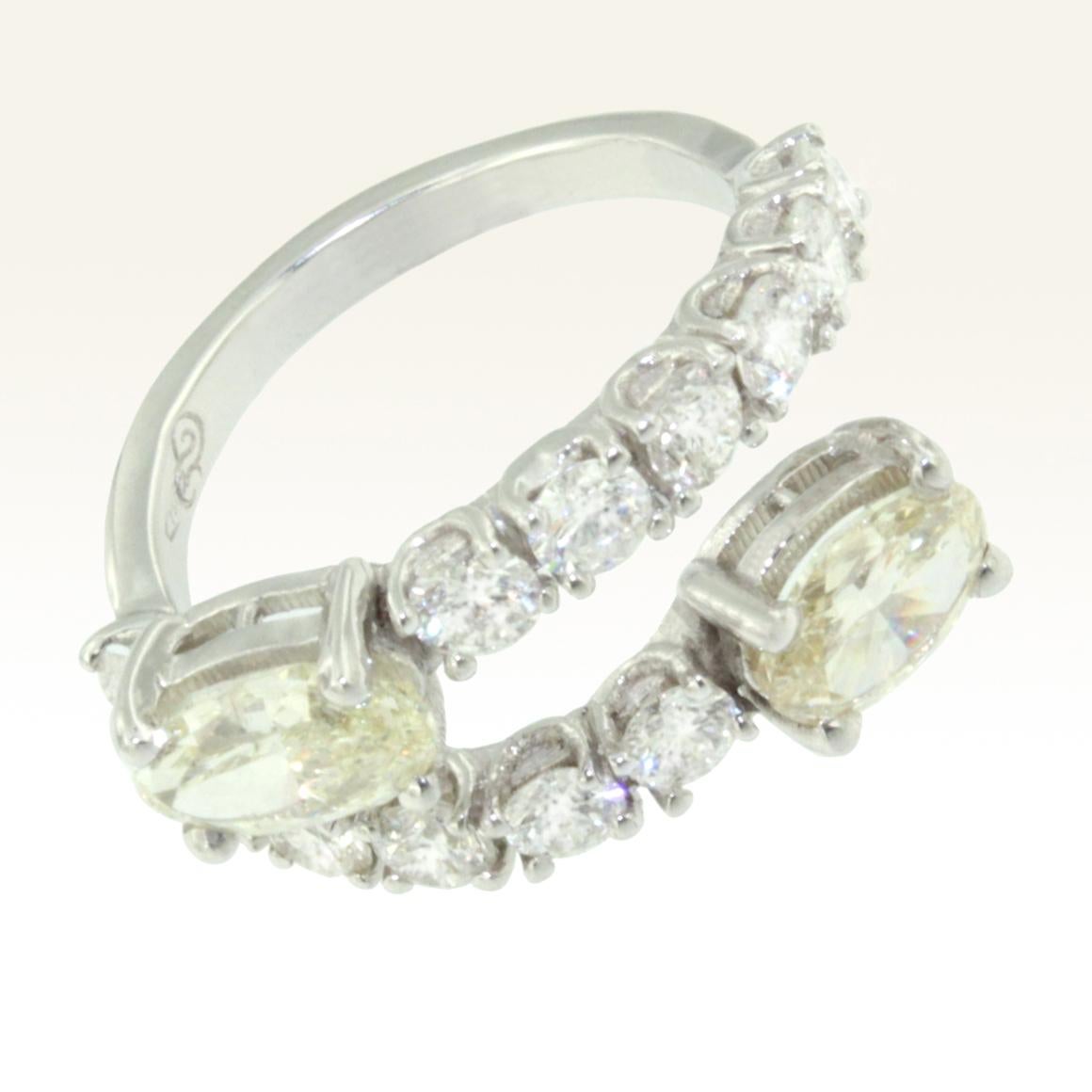 Oval Cut 18 Karat White Gold with White Diamonds and Yellow Diamond Amazing Modern Ring For Sale