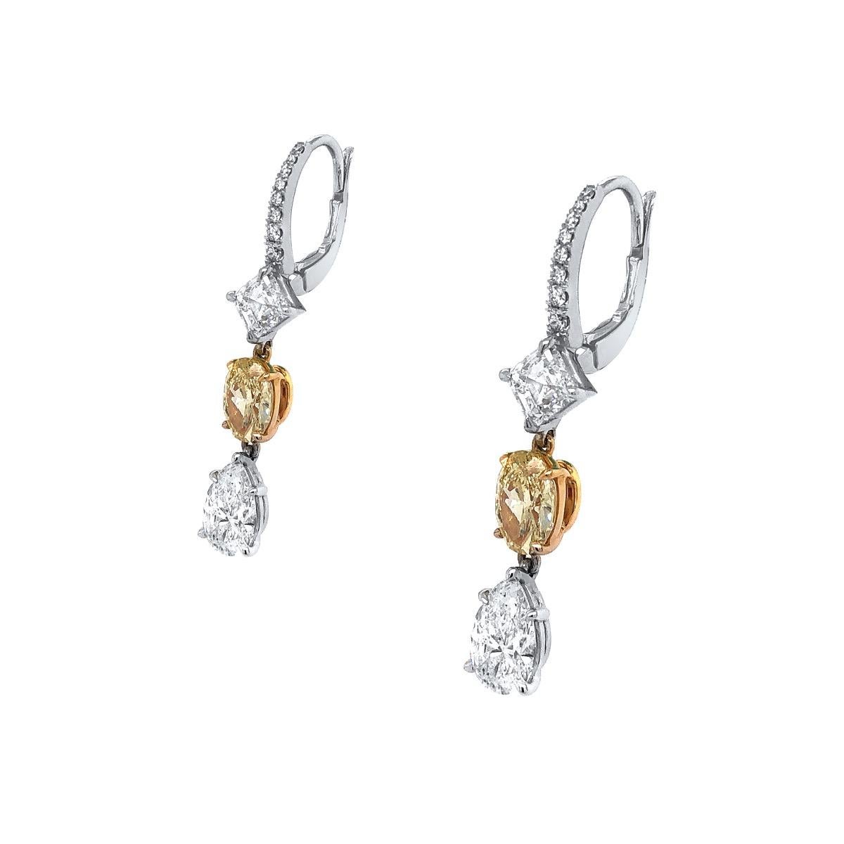 Style: Dropped Stlyled Fancy Yellow Diamond Earrings with White Diamonds 

Metal type: 18kt White Gold 

2 total  1.97ct I yellow diamonds 

2 total 1.42ct I-W range Si2
 
2 total 2.00ct pear shape F/Si2 White Diamonds   
 
Location Of Stone: None
