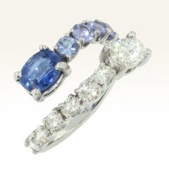 18 Karat White Gold Tanzanites and White Diamond Cocktail Modern Eternity Ring