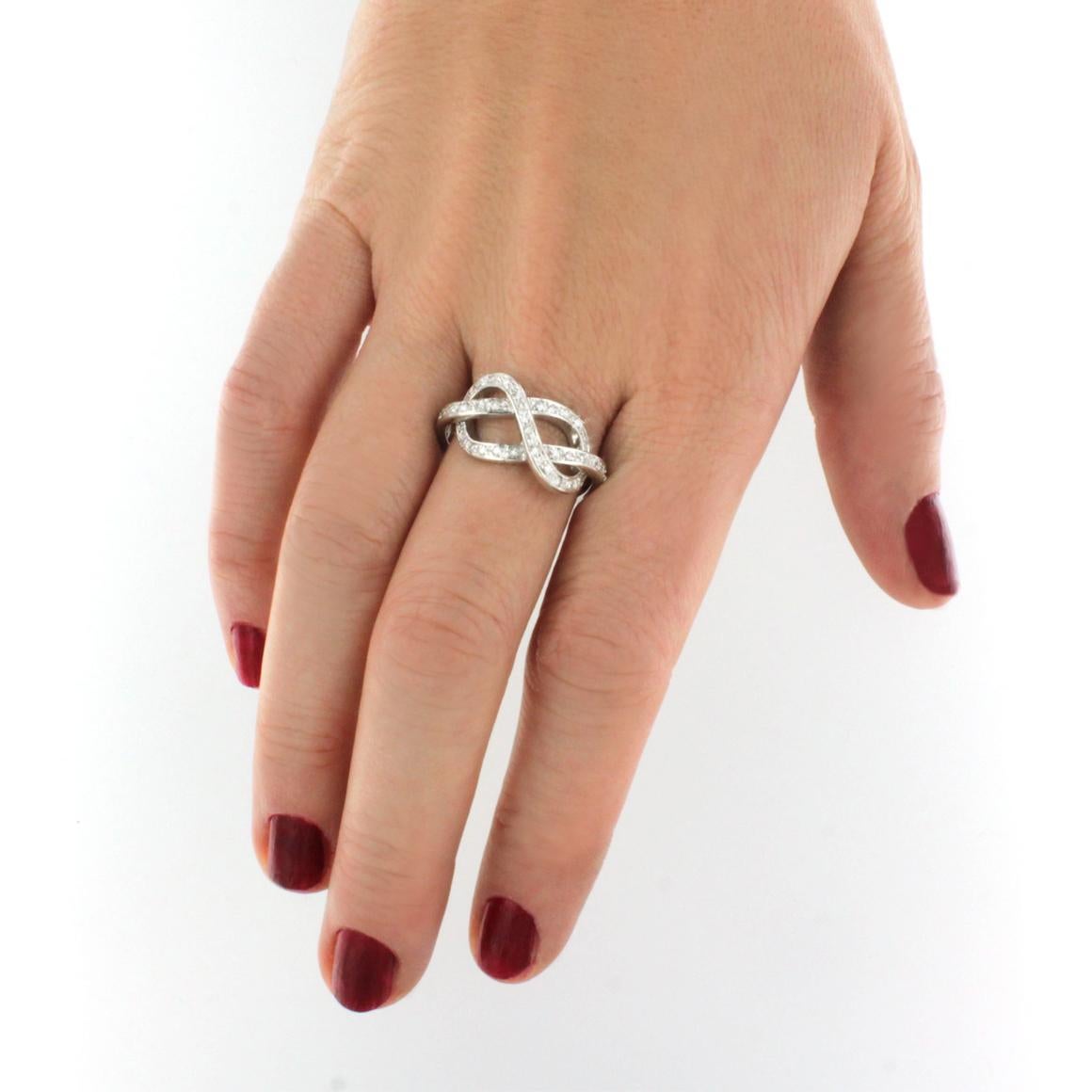 Intertwining of love.  It's a love knot . Timeless ring with white diamonds.
Ring in 18k white gold with white Diamonds cts 0.18 VS colour G/H. 

Size of ring:  15 EU -  8 USA 

All Stanoppi Jewelry is new and has never been previously owned or