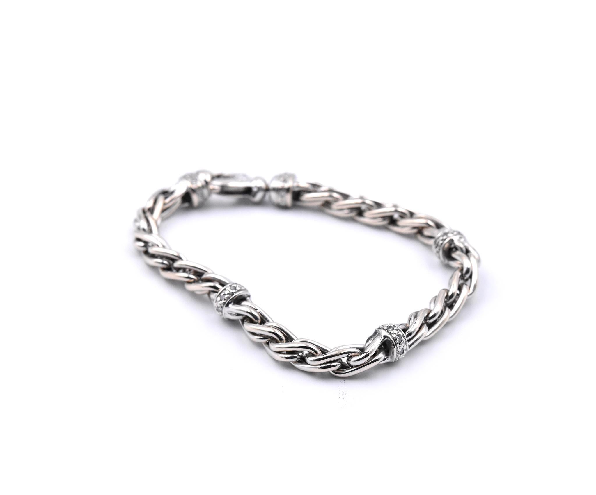 Designer: custom 
Material: 18k white gold
Diamonds: 46 round brilliant cuts 
Dimensions: bracelet will fit a size 7-inch wrist, bracelet measures 7.00mm wide
Weight: 34.72 grams
