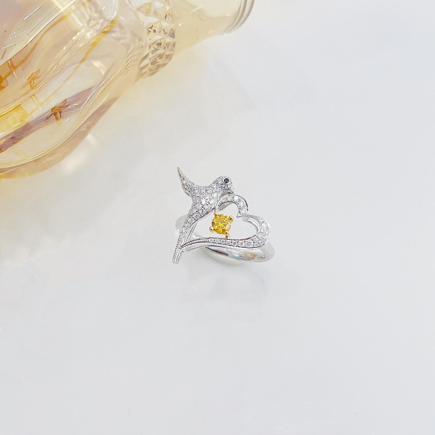 18K White Gold Yellow Diamond Bird Ring with Diamonds

1 Yellow Diamond - 0.16 CT
Diamonds - 0.31 CT

Total Weight - 3.47 GM