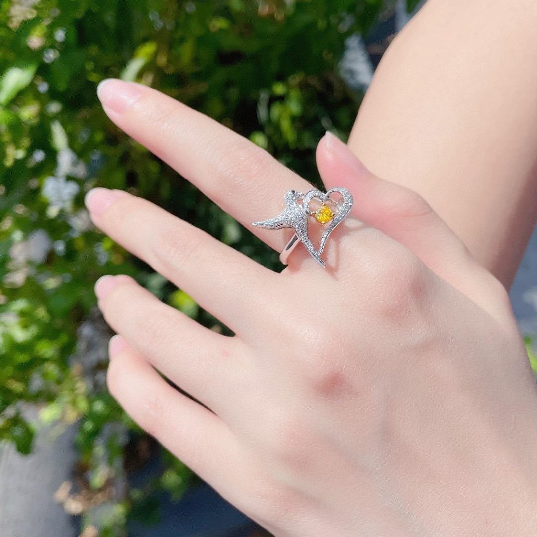 Modern 18K White Gold Yellow Diamond Bird Ring with Diamonds For Sale