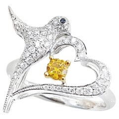 Bague oiseau en or blanc 18 carats avec diamants jaunes