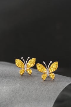 Boucles d'oreilles en or blanc 18K et diamant jaune