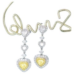 Orecchini con diamanti gialli in oro bianco 18 carati