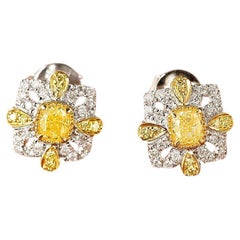 Orecchini con diamanti gialli in oro bianco 18 carati