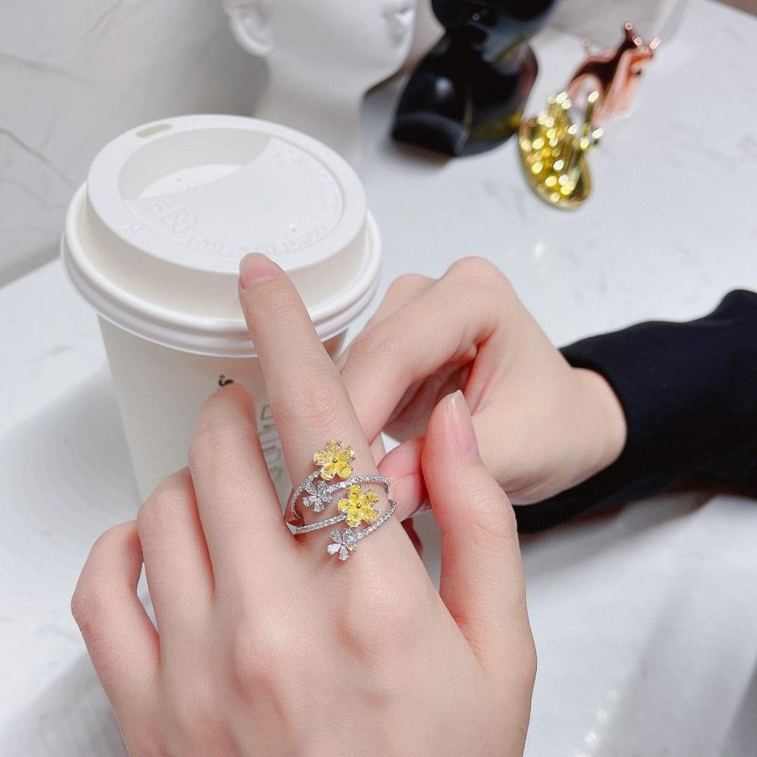 Modern 18K White Gold Yellow Diamond Flower Ring with Diamonds For Sale