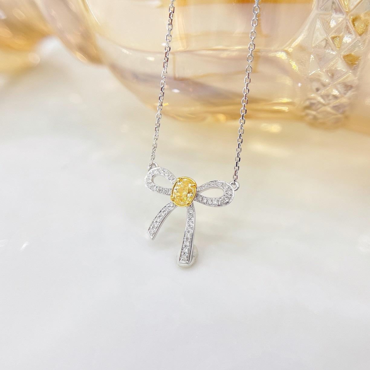 Modern 18K White Gold Yellow Diamond & Round Diamond Bow Pendant Necklace For Sale