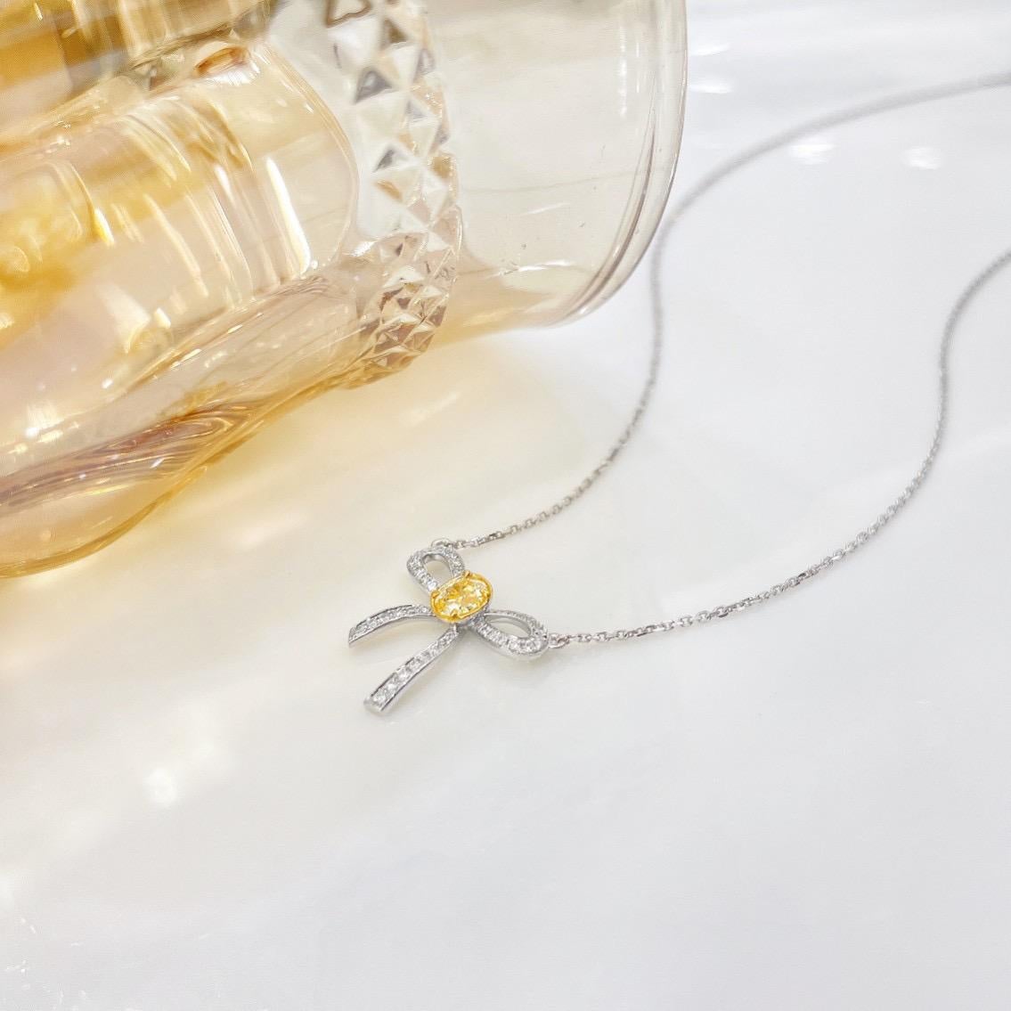 Oval Cut 18K White Gold Yellow Diamond & Round Diamond Bow Pendant Necklace For Sale
