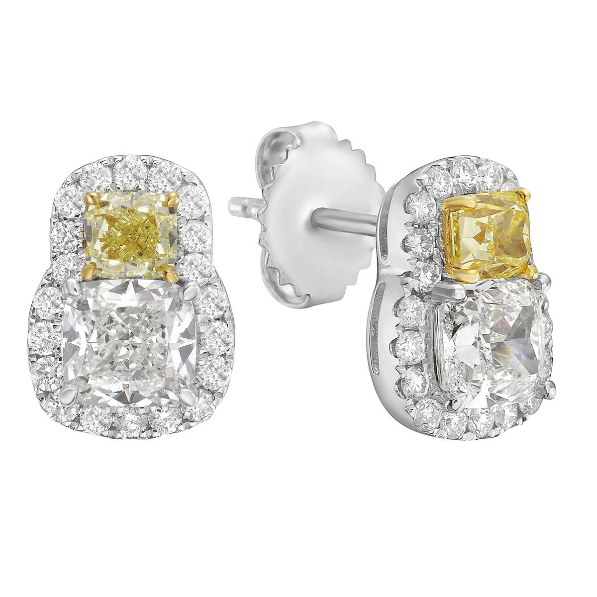 These stunning earrings feature rare and beautiful yellow diamonds as the main highlight. Set in 18K white gold, they offer a bright and colorful look that stands out with simple elegance. The earrings include two yellow diamonds totaling 0.66