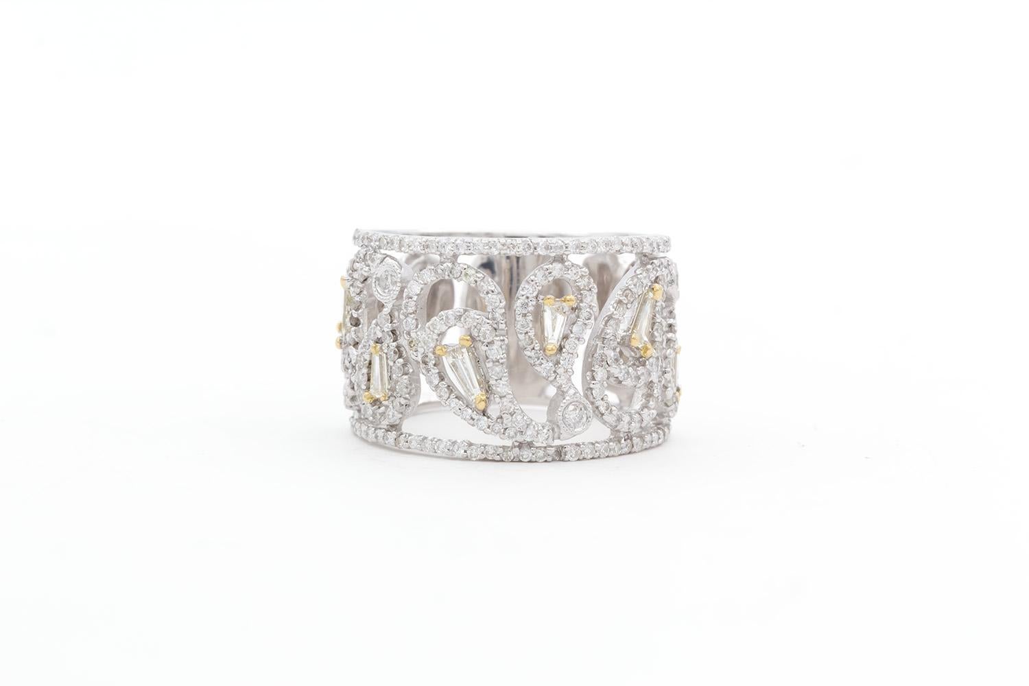 We are pleased to present this 18K White Gold Yellow Gold & Diamond Lattice Cocktail Ring. This beautiful ring feature an estimated 1.50ct tapered baguette and round brilliant cut diamonds set in an 18k White & Yellow Gold lattice style cocktail