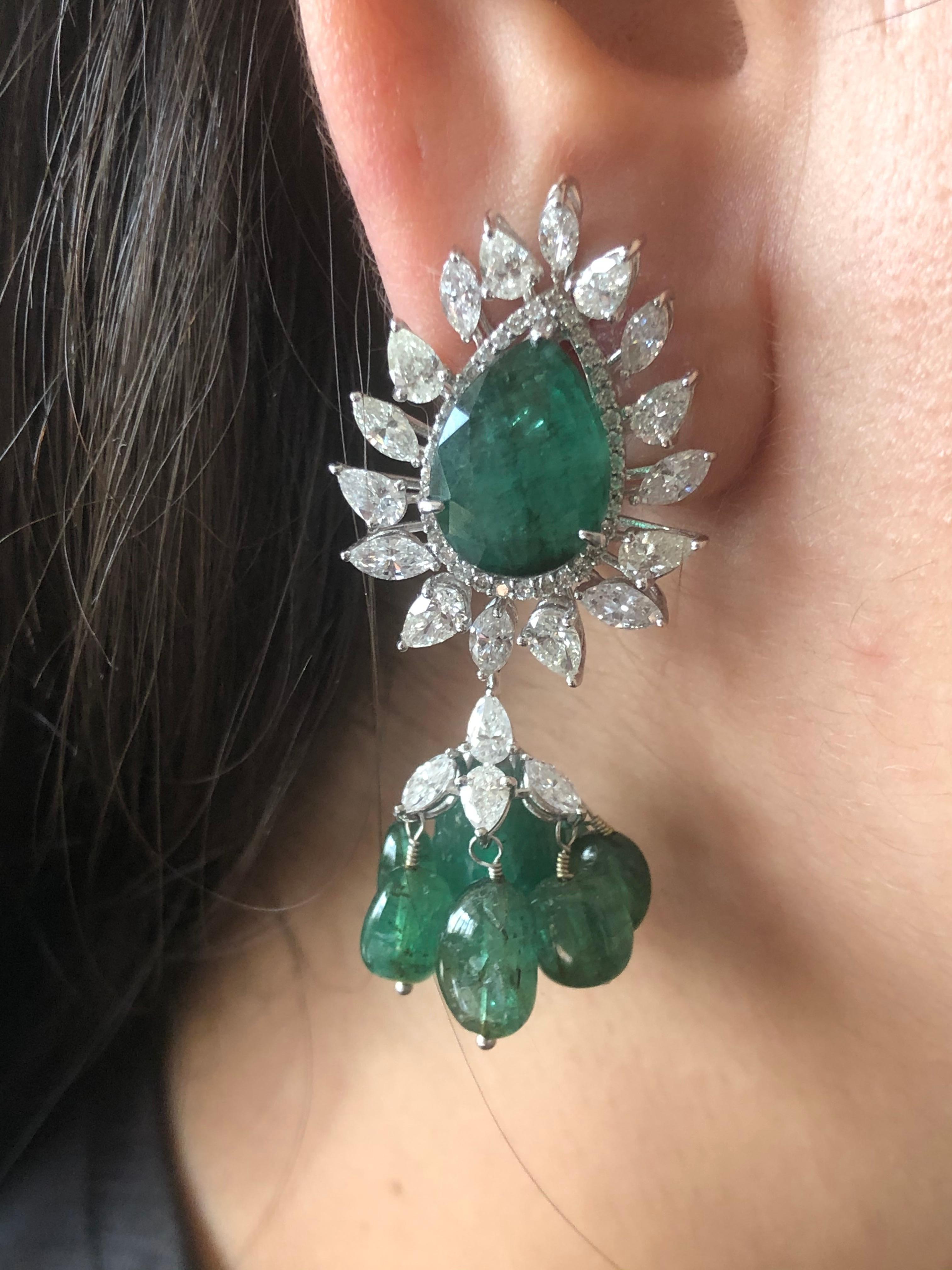 Diamond: 4.05 carats 
Emerald: 33.33 carats 
Gold: 15.080 grams 18k 
Colour: GH
Clarity: SI1
Item Code: DT IFA 
Note: These earrings can also be made in Ruby 
This season be the cynosure of everyones eyes with these limited edition earrings from our