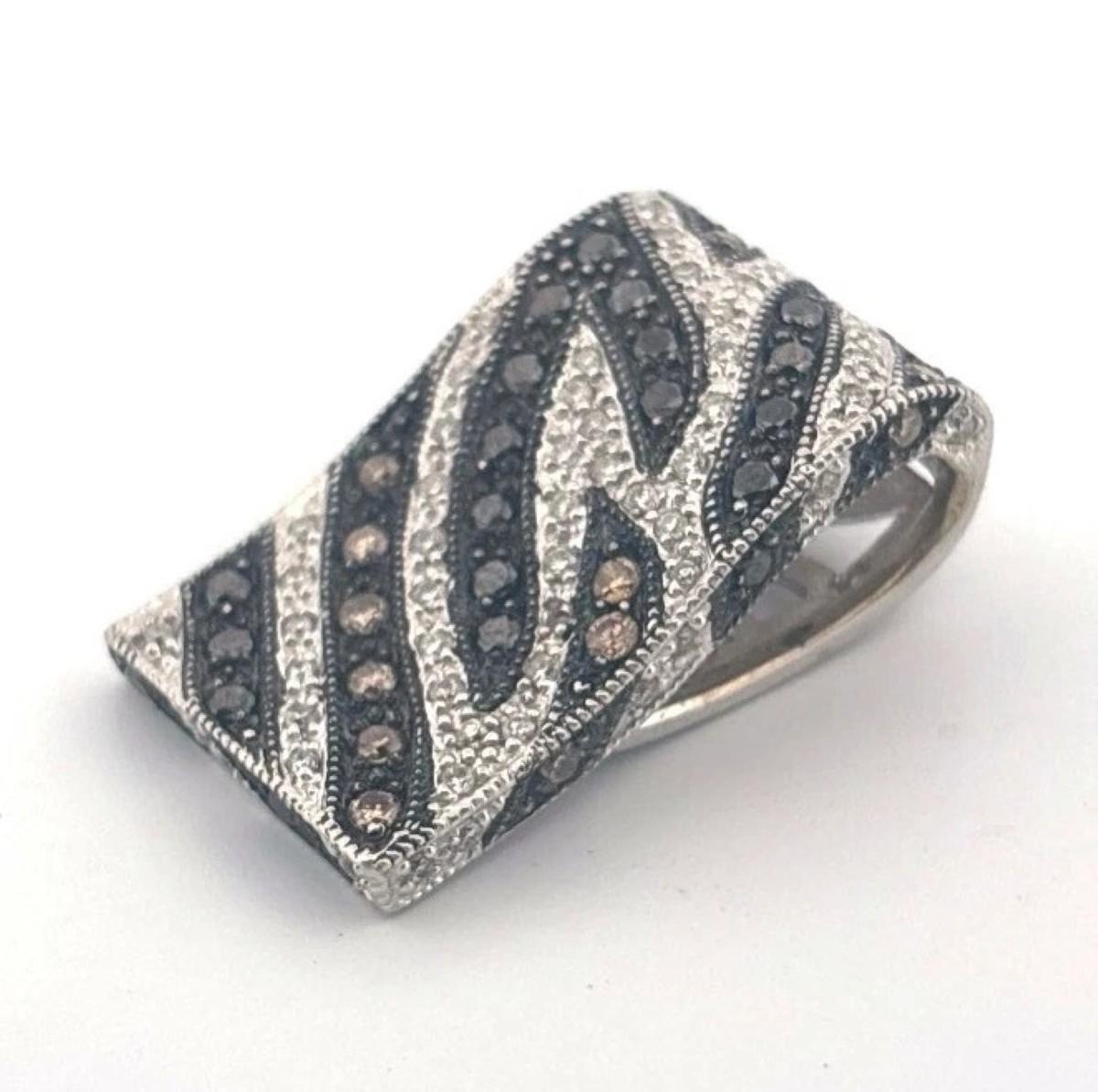 ✦ Offered is one (1) estate diamond slide pendant crafted in solid 18K white gold, featuring a sculptural zebra-stripe design with natural white, treated black, and chocolate-colored diamonds in a pavé and bead-set pattern. The pendant has a bold,