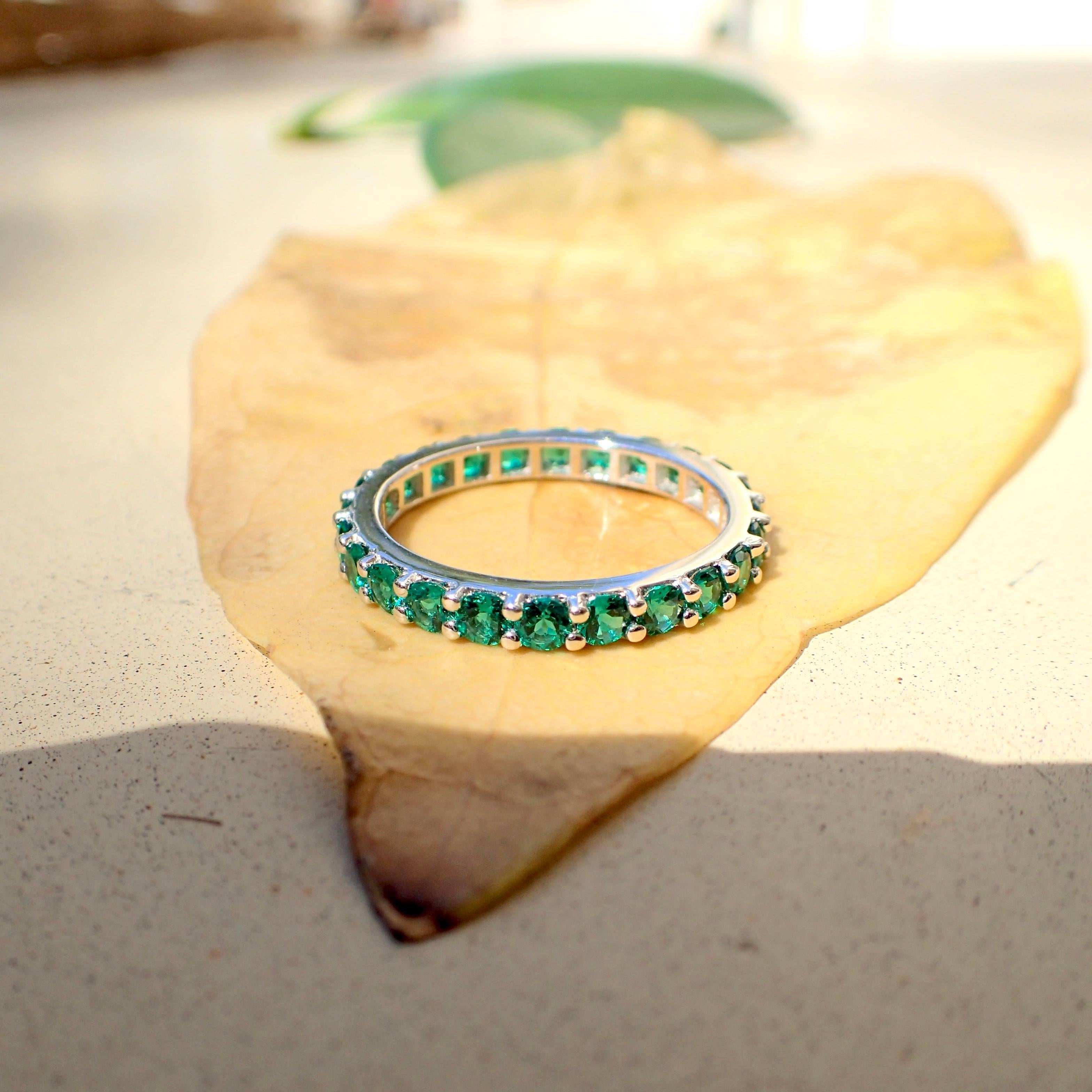Contemporary 18 Karat Gold Eternity Band with Chatham-Created Emeralds Weighing 1.22 Carat