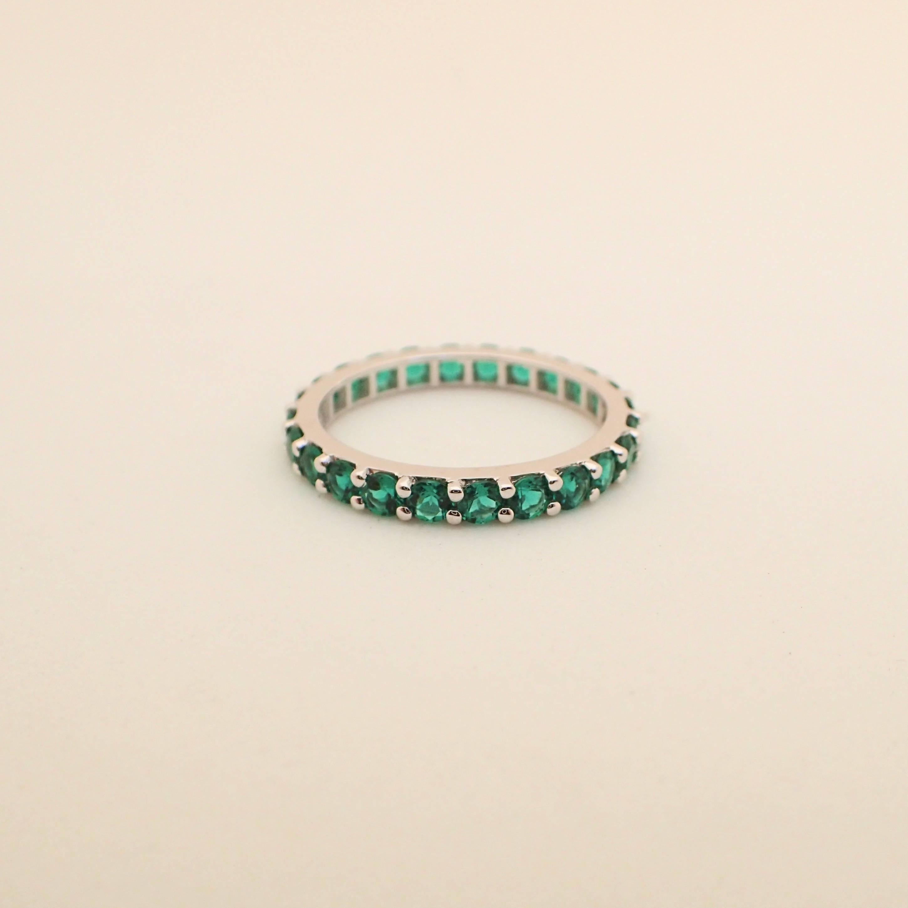 18 Karat Gold Eternity Band with Chatham-Created Emeralds Weighing 1.22 Carat 2