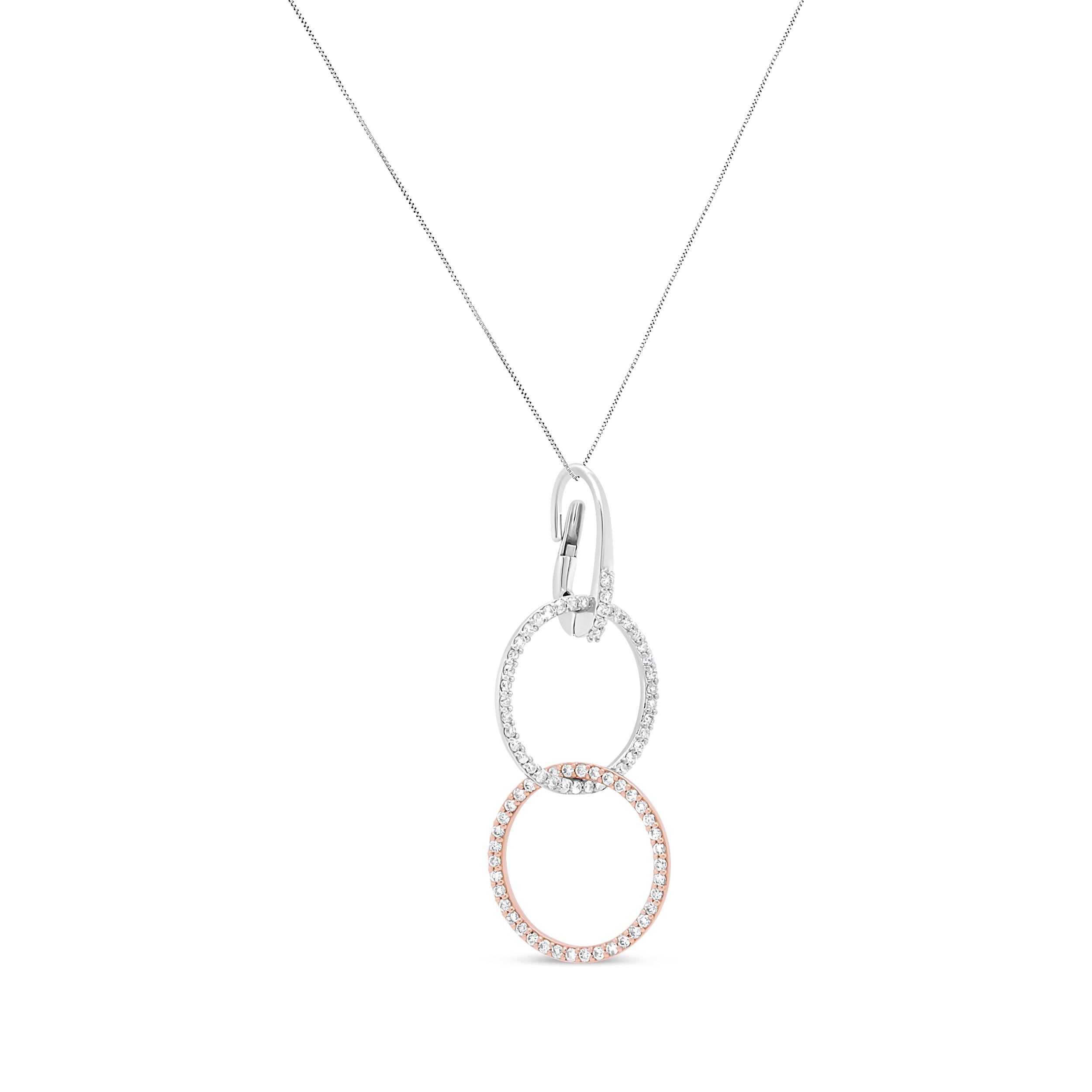 This striking pendant necklace shows off a visually enchanting design concept comprised of interlocked circles in a vertical pattern encrusted with shimmering white diamonds. The two tone metal shows off a blend of 18k white and rose gold in a